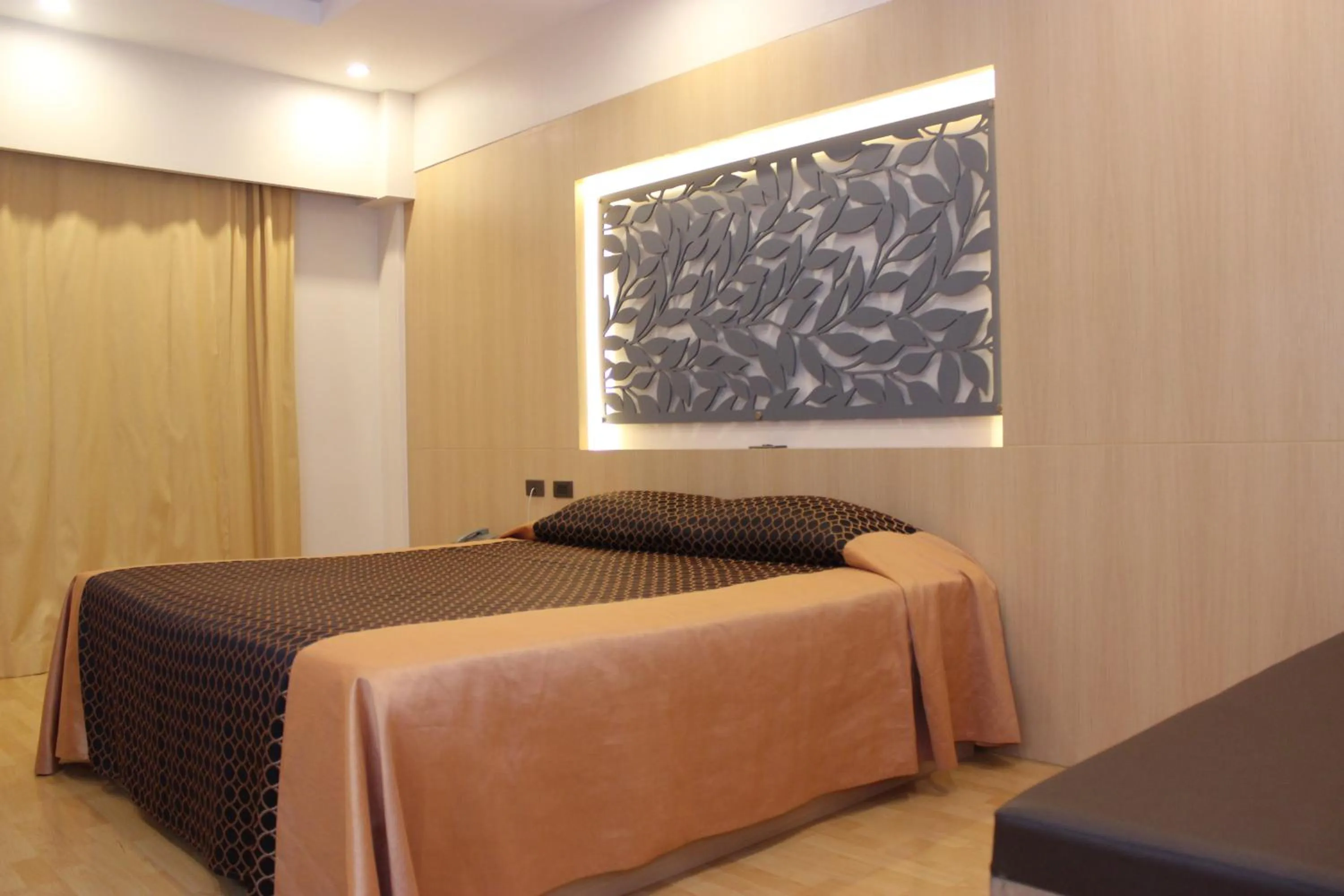 Bed in Charoen Hotel