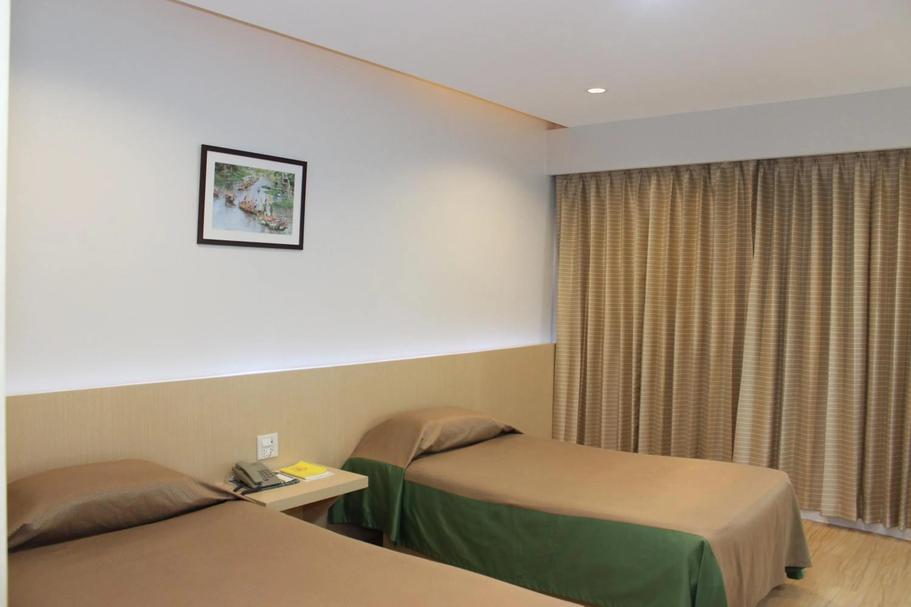 Bed in Charoen Hotel