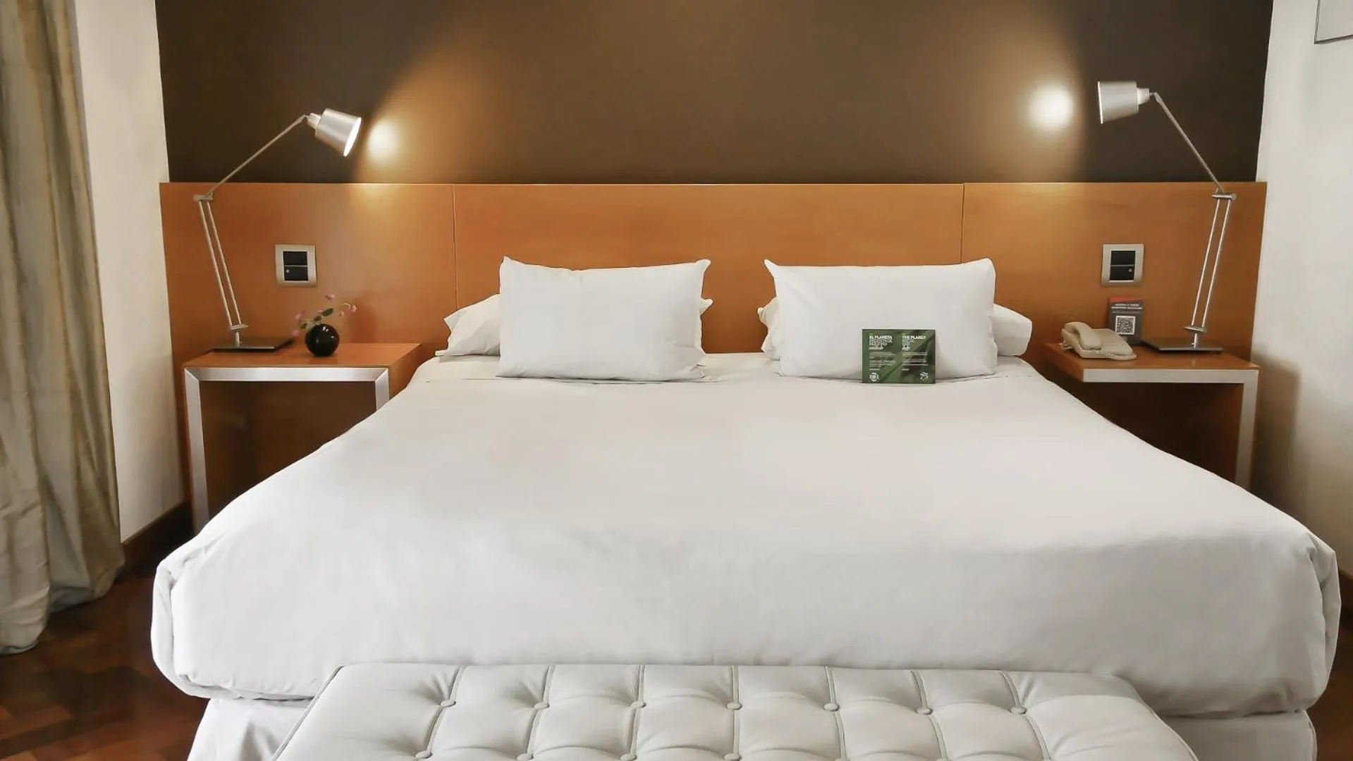 Bed in 725 Continental Hotel