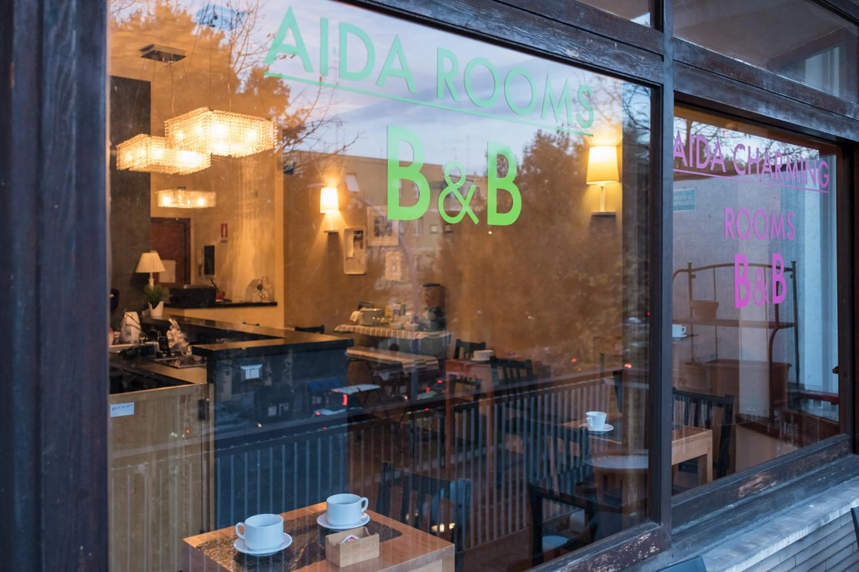 Property logo or sign in Aida Charming Rooms