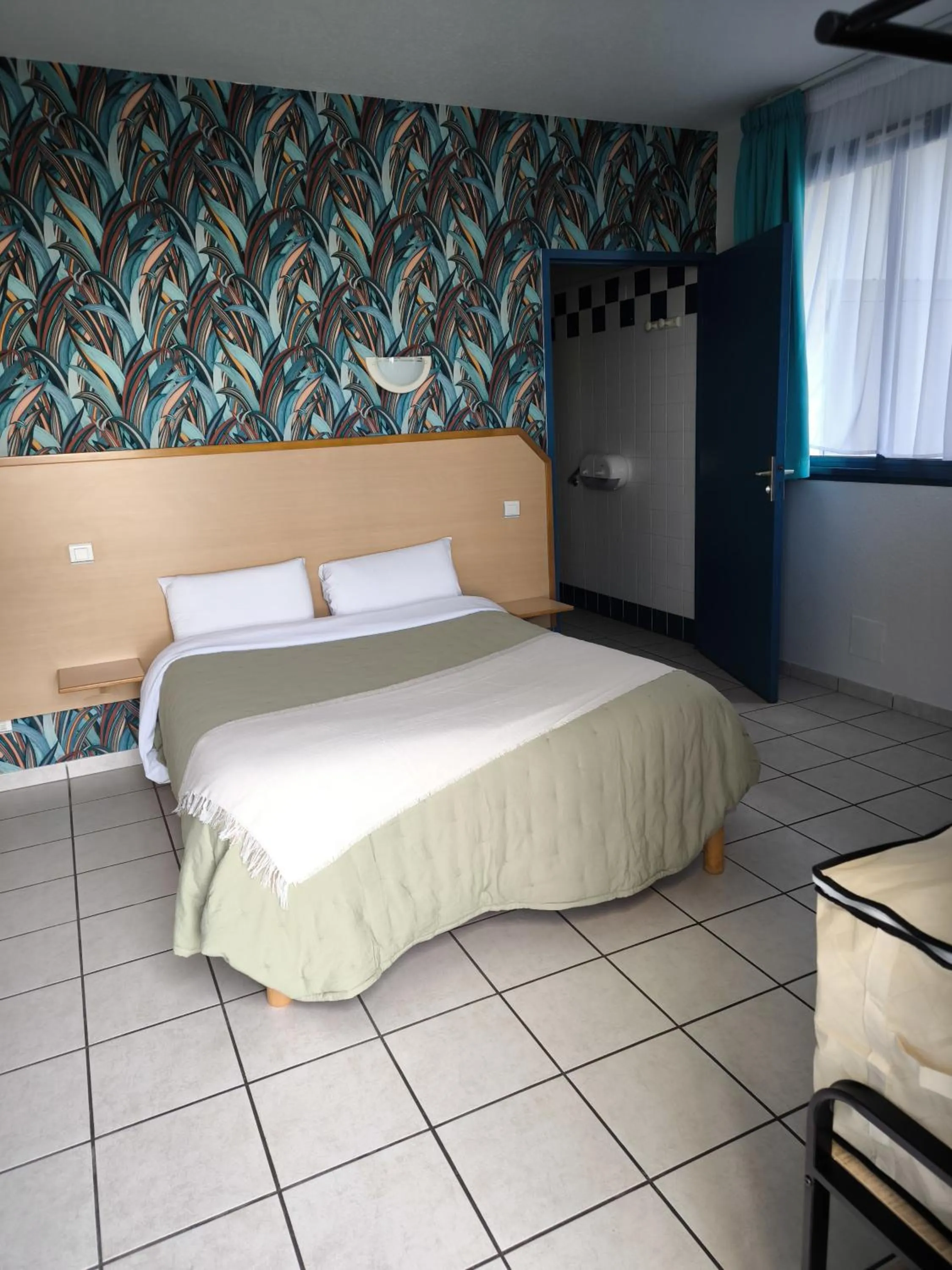 Bed in Hôtel Le Laury's