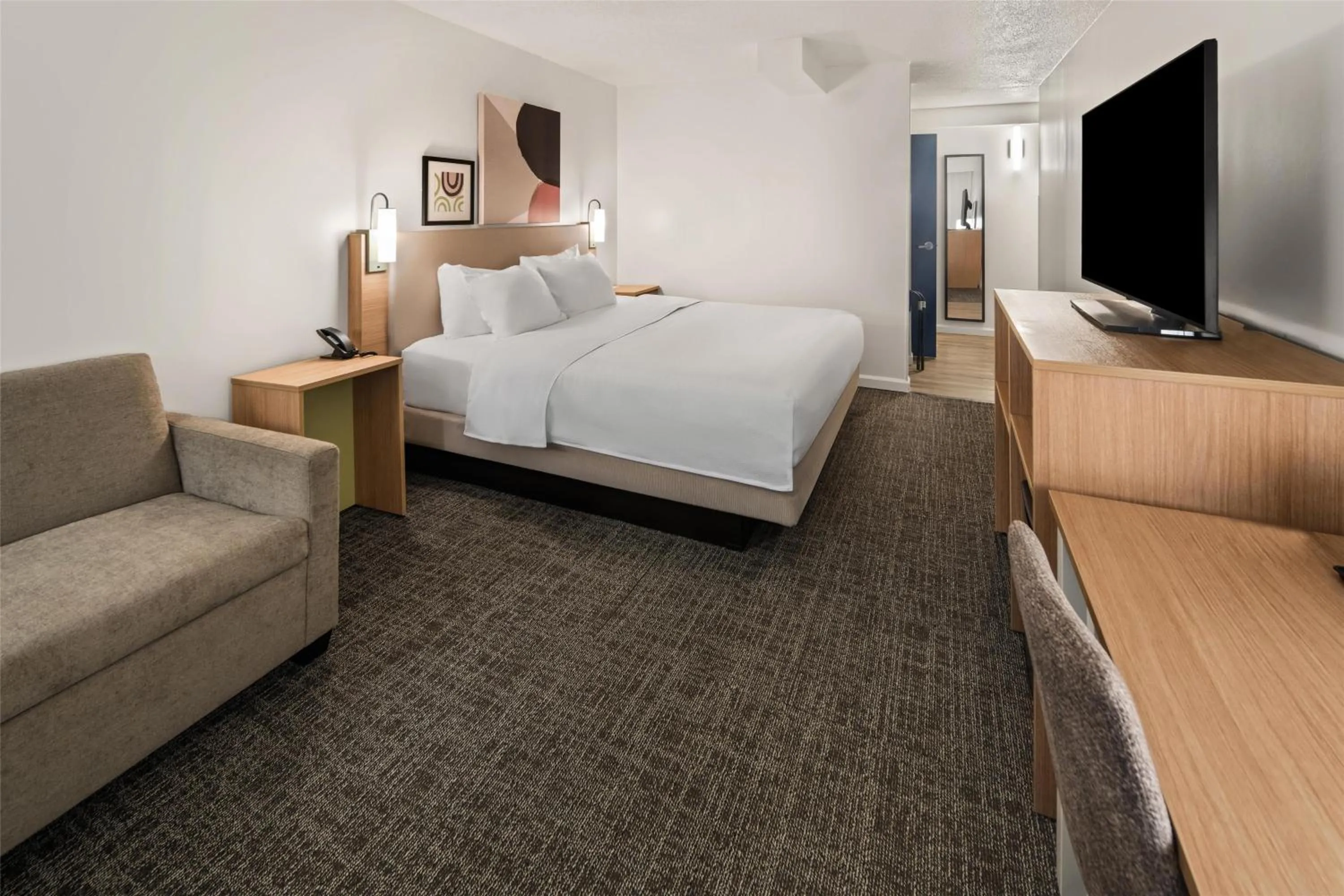 Living room, Bed in Spark by Hilton Waldorf