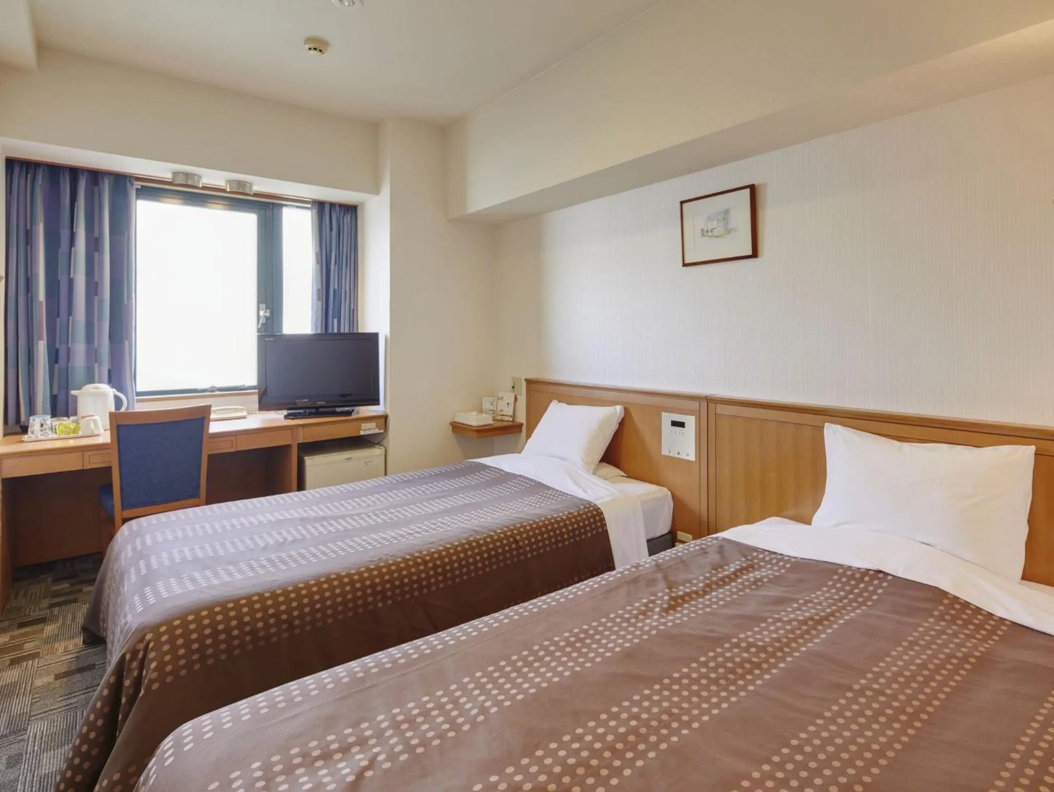 Photo of the whole room, Bed in Hotel Roco Inn Okinawa