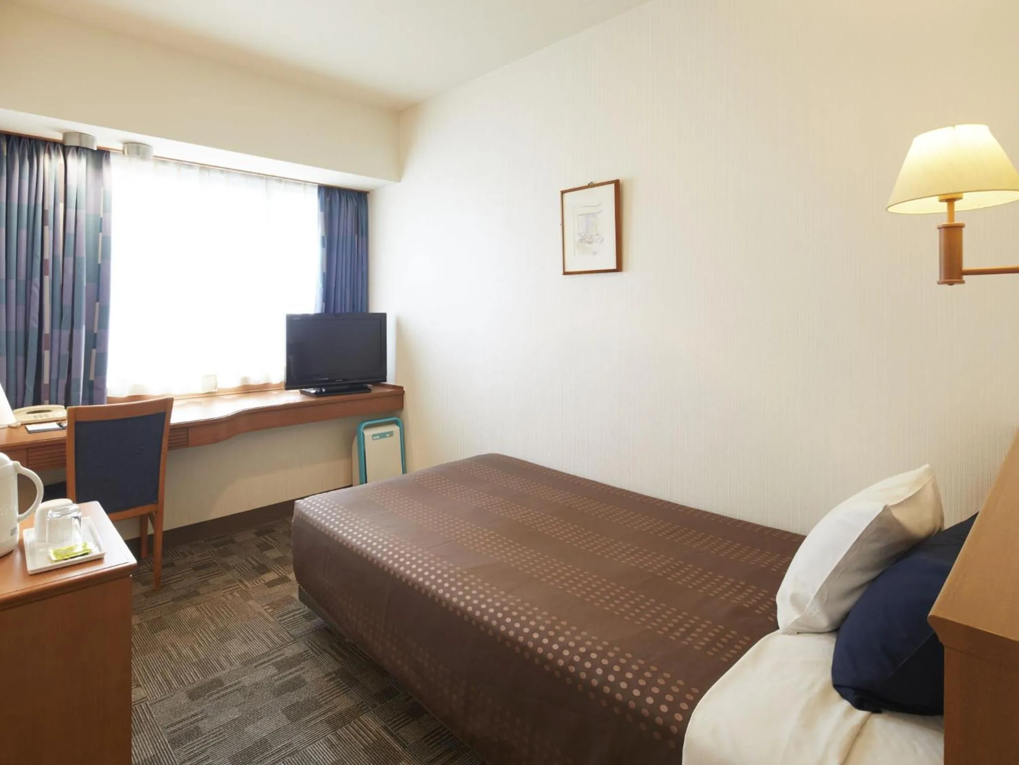 Photo of the whole room, Bed in Hotel Roco Inn Okinawa