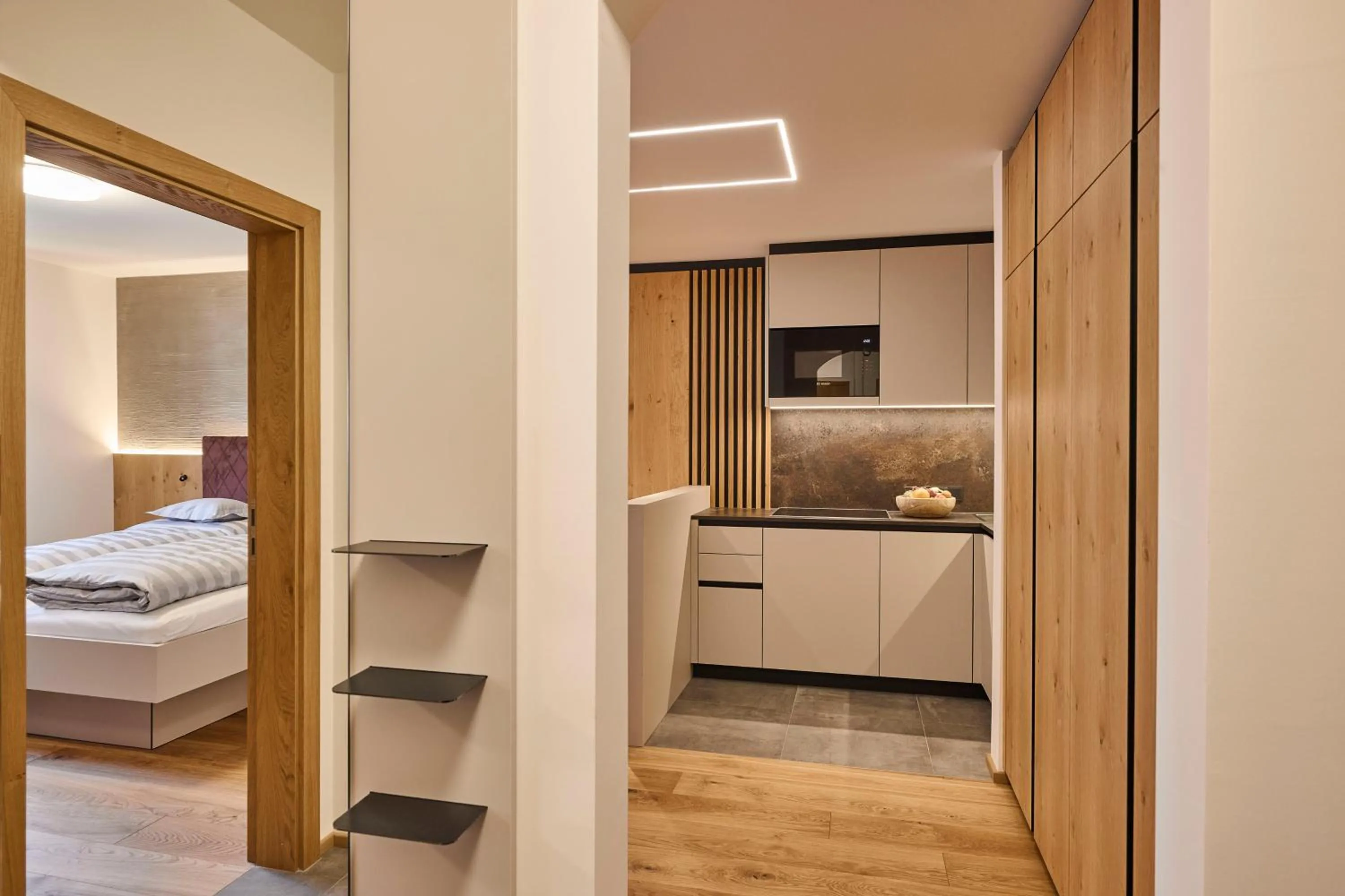 Kitchen or kitchenette, Bed in Appartements Täli
