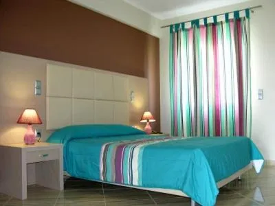 Bed in Antonios Village Hotel & Apartments