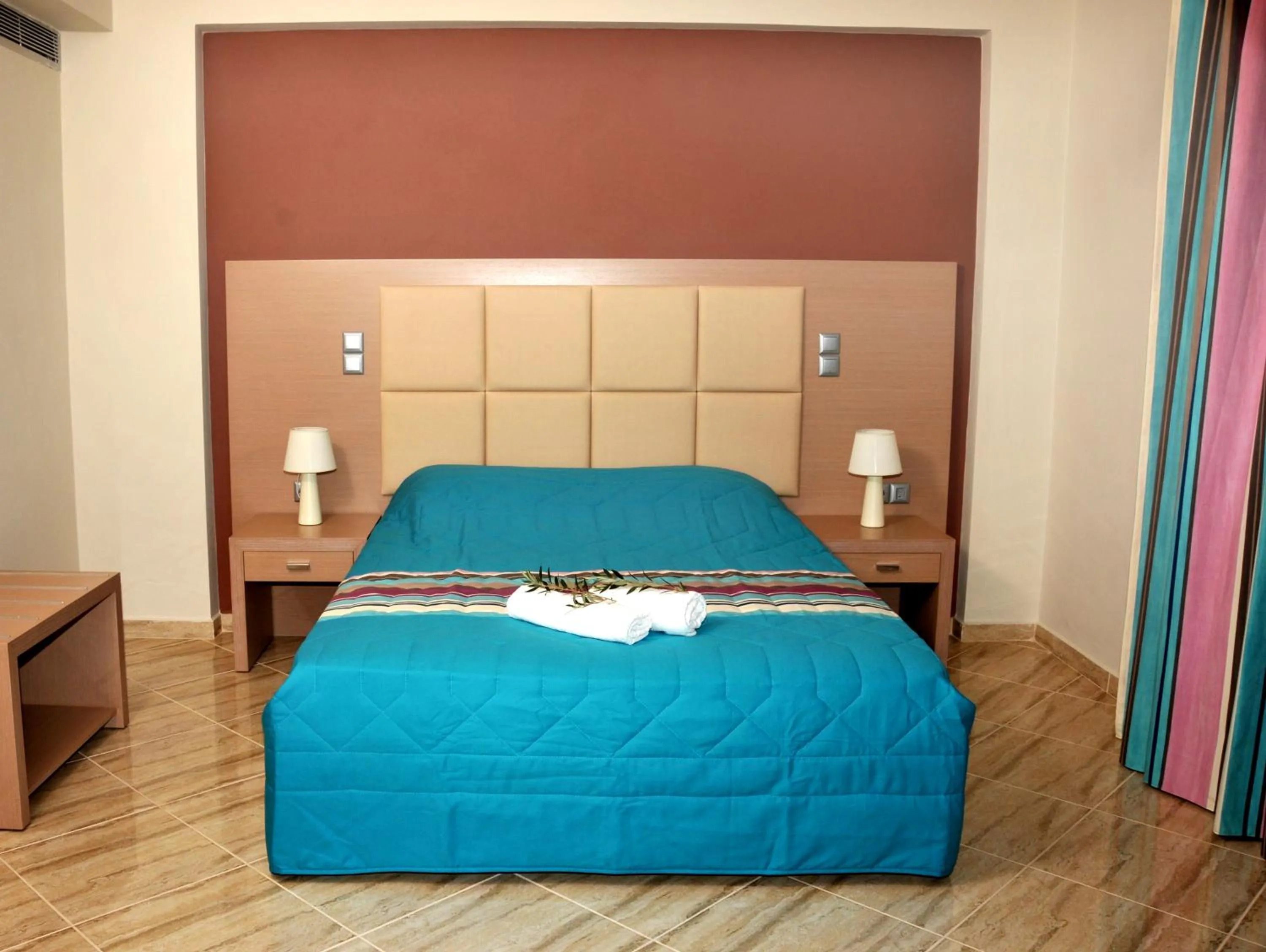 Bed in Antonios Village Hotel & Apartments