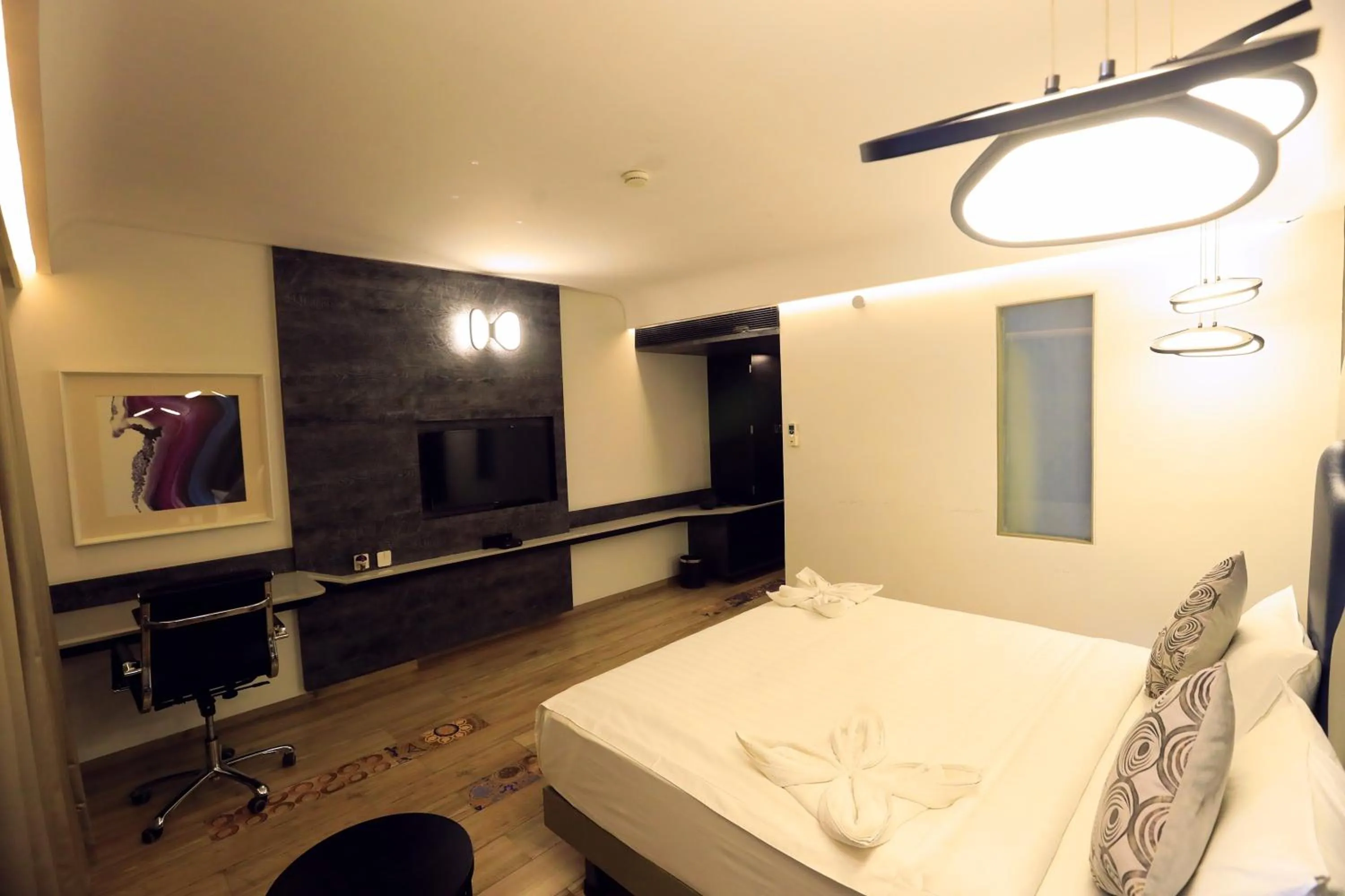 Bed in Humming Bird Hotel & Banquet