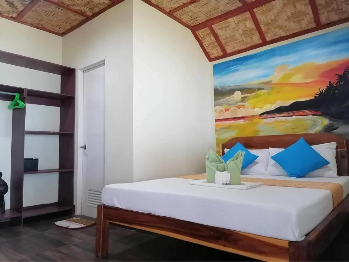 Bed in Mecaja Beach House