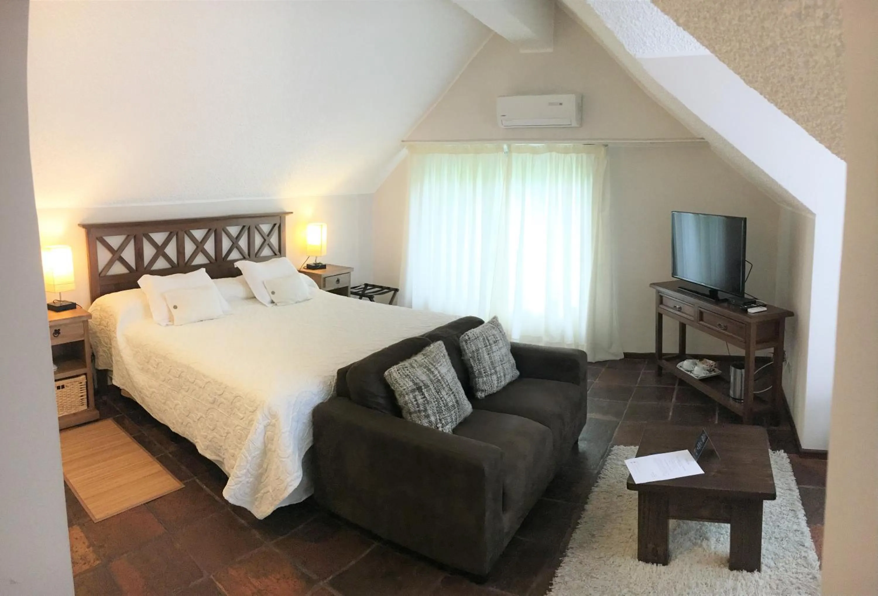 Bed in Petit Chateau Hotel Boutique