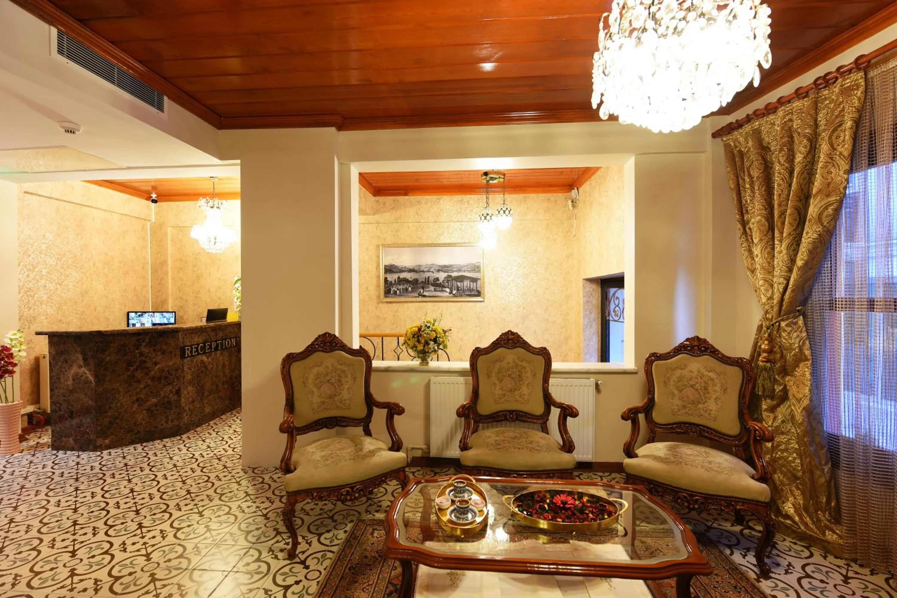 Communal lounge/ TV room in Elyka Hotel