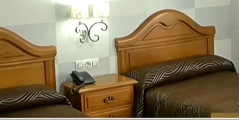 Bed in Hotel Bruselas