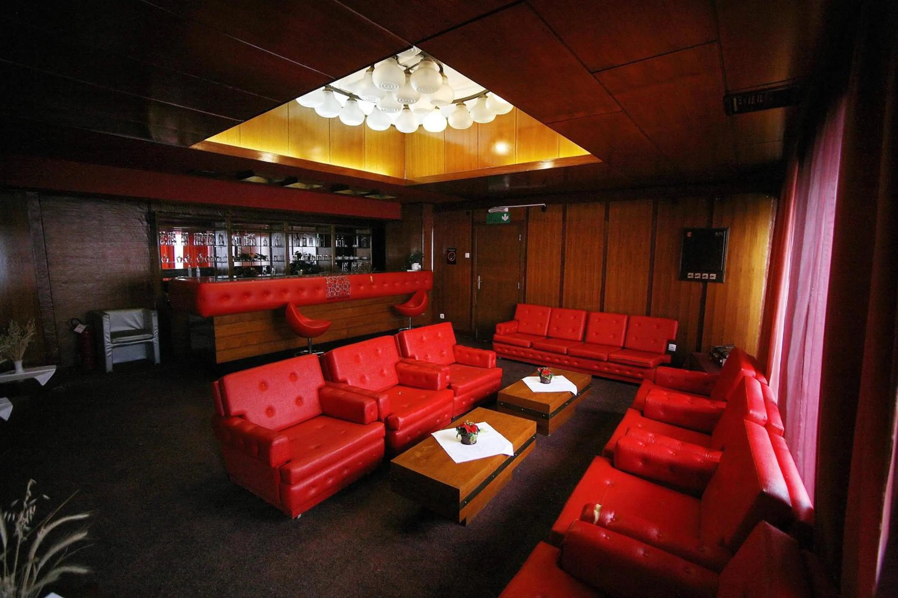 Communal lounge/ TV room in Golden Inn Hotel