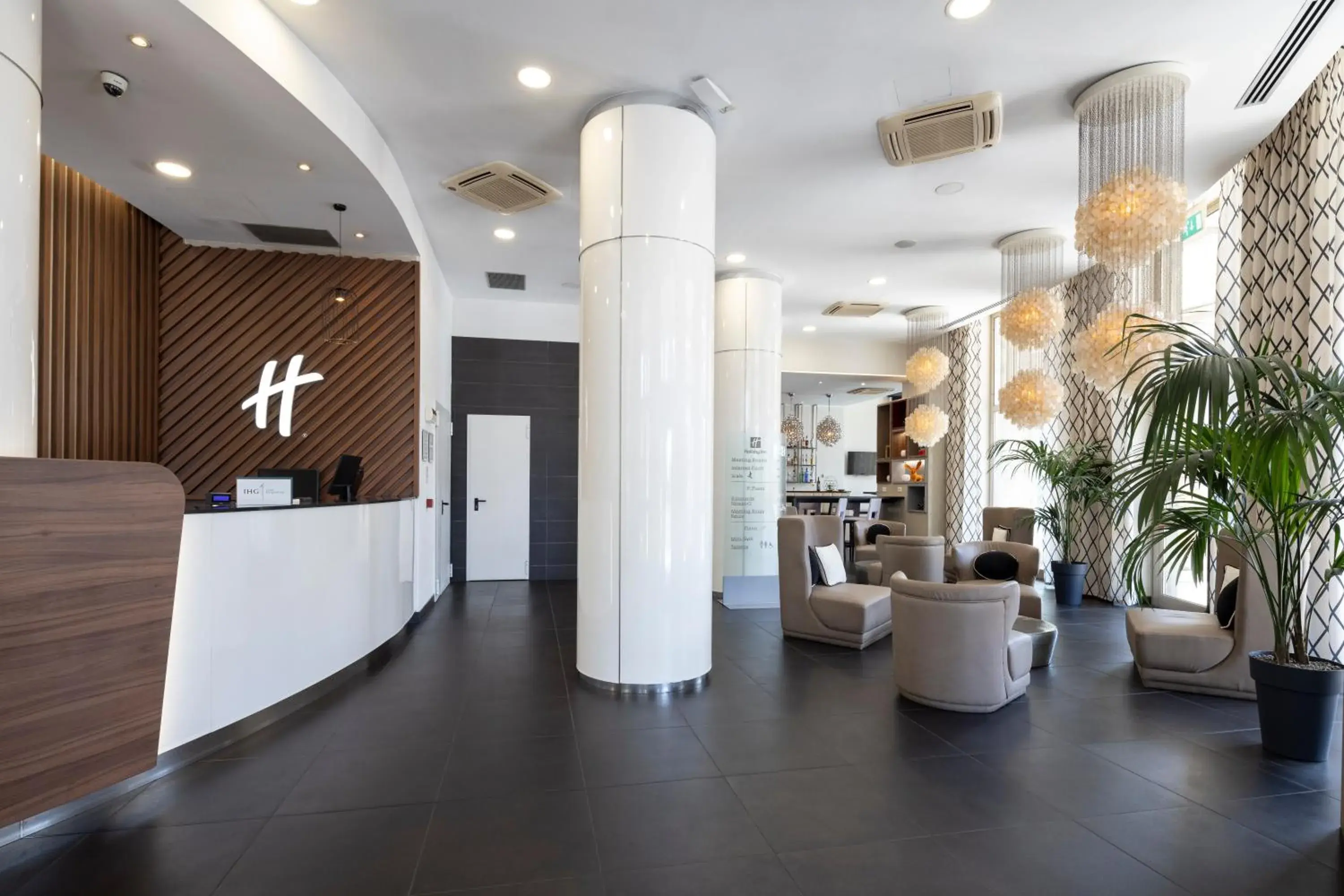 Lobby or reception in Holiday Inn Genoa City by IHG Lobby or reception in Holiday Inn Genoa City by IHG