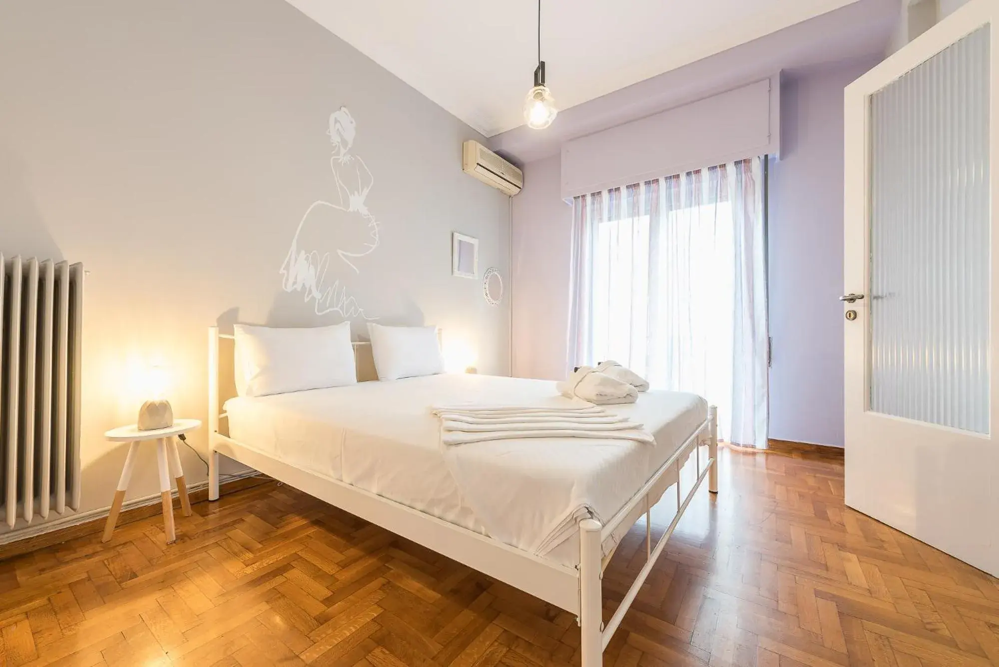 Bed in Athens Boutique Apartment by Cloudkeys Bed in Athens Boutique Apartment by Cloudkeys