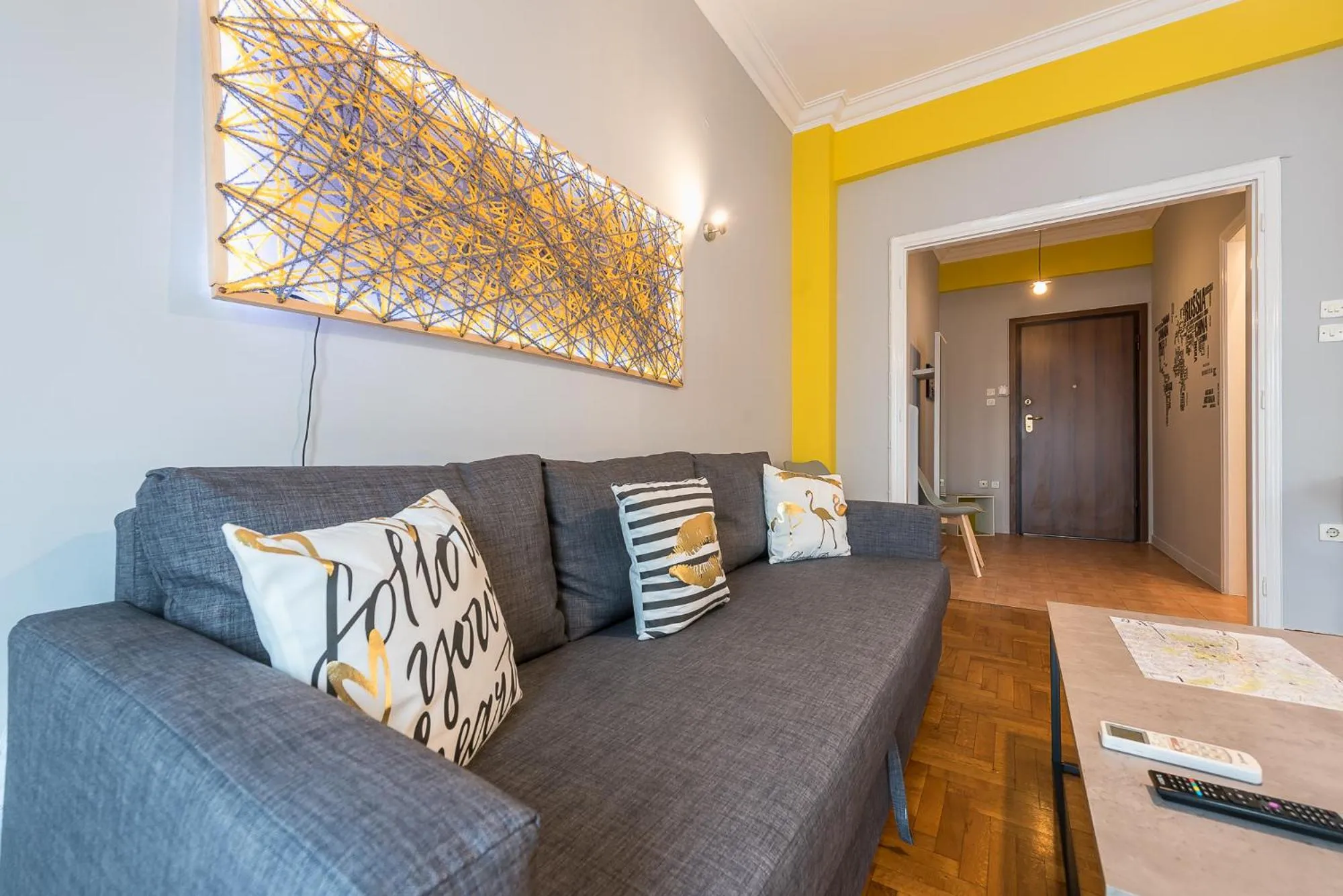 Living room in Athens Boutique Apartment by Cloudkeys