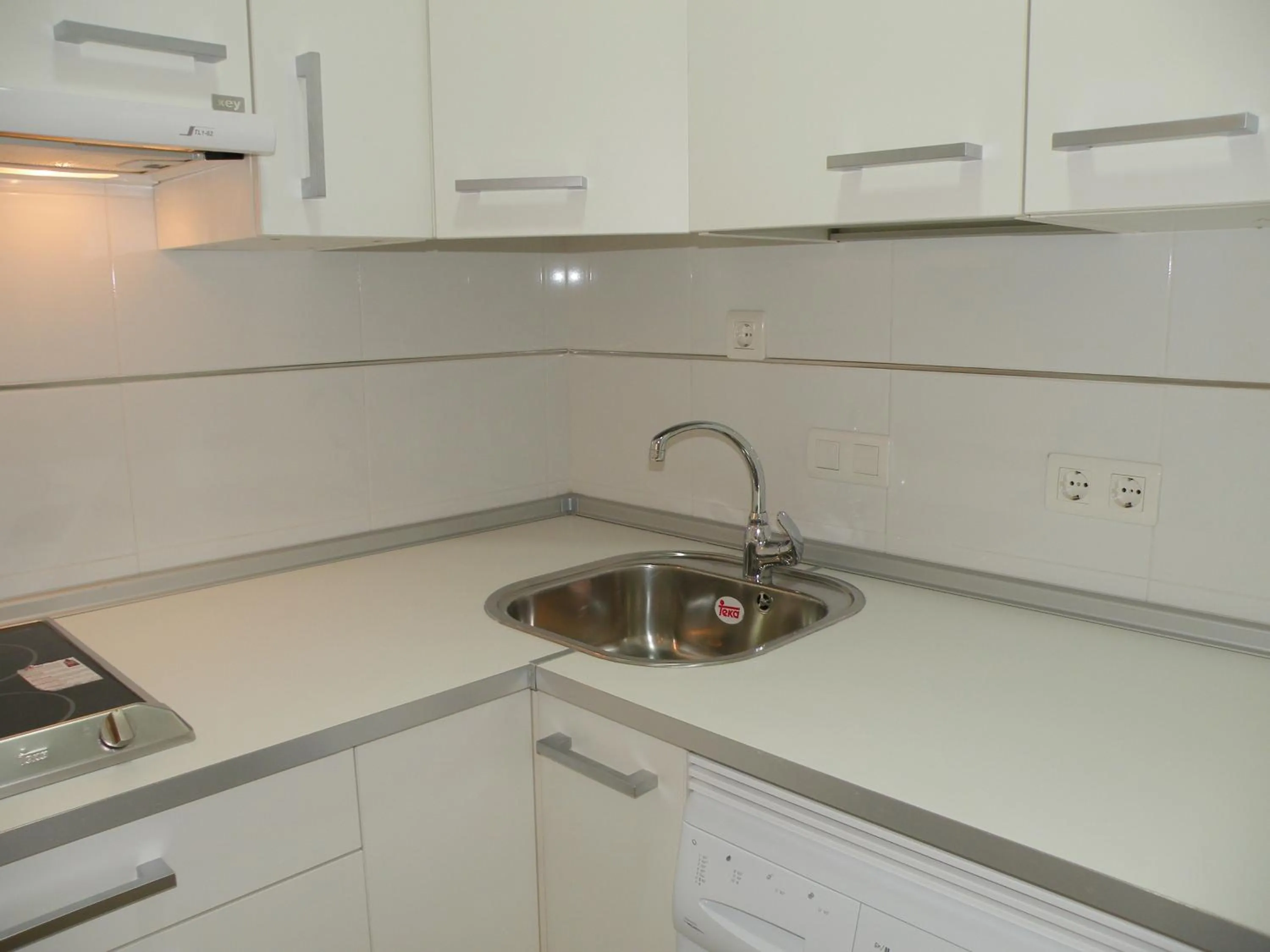 Kitchen or kitchenette in Apartamentos Doña Carmen