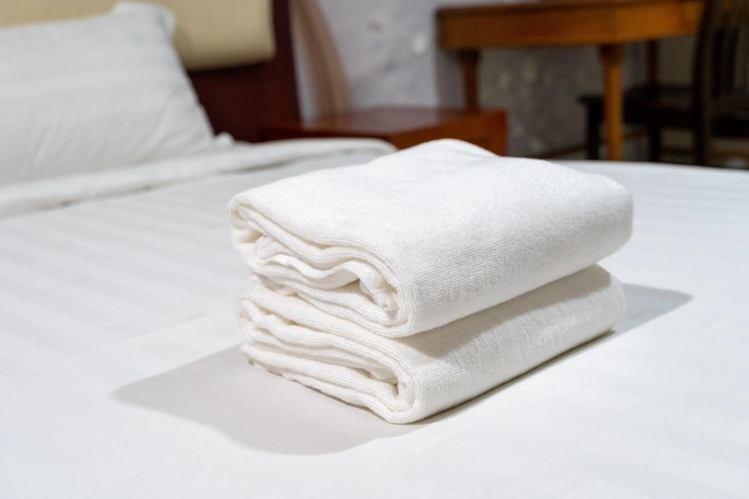towels, Bed in Pertama Lodge