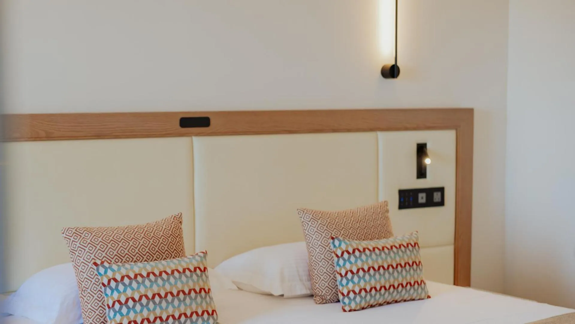 Bed in Golden Coast Beach Hotel