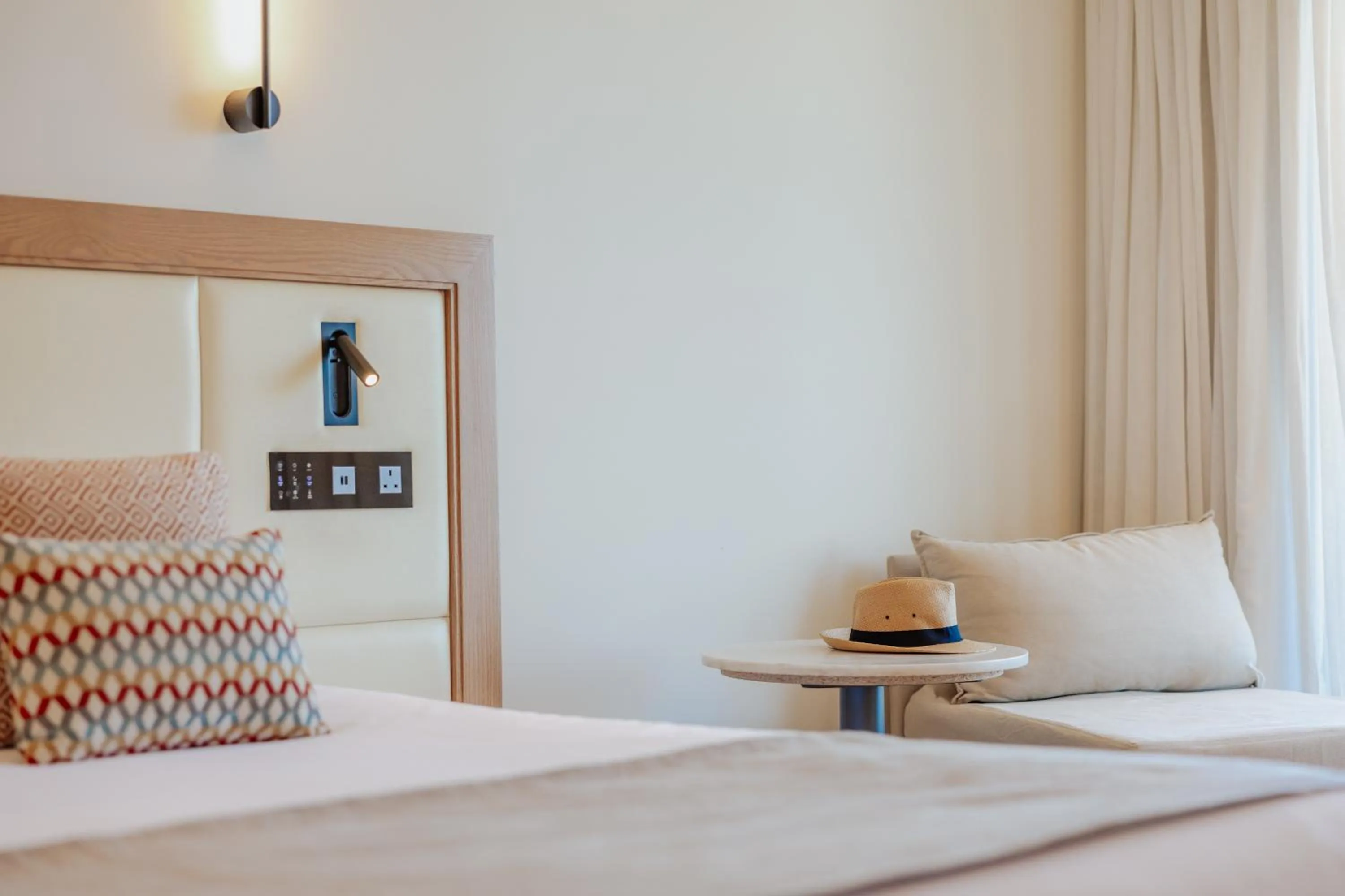 Bed in Golden Coast Beach Hotel