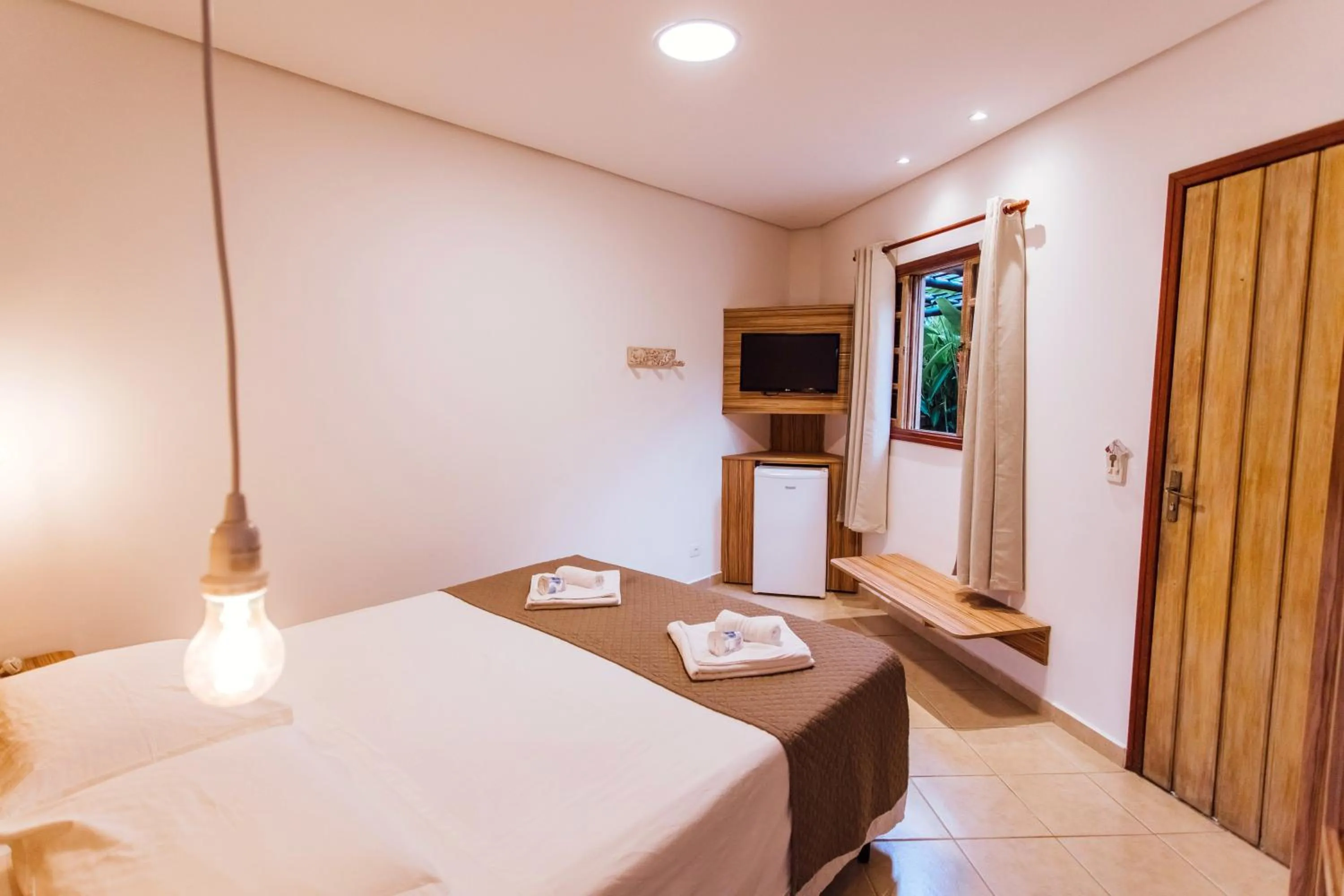 Bed in VELINN Pousada Villa Caiçara