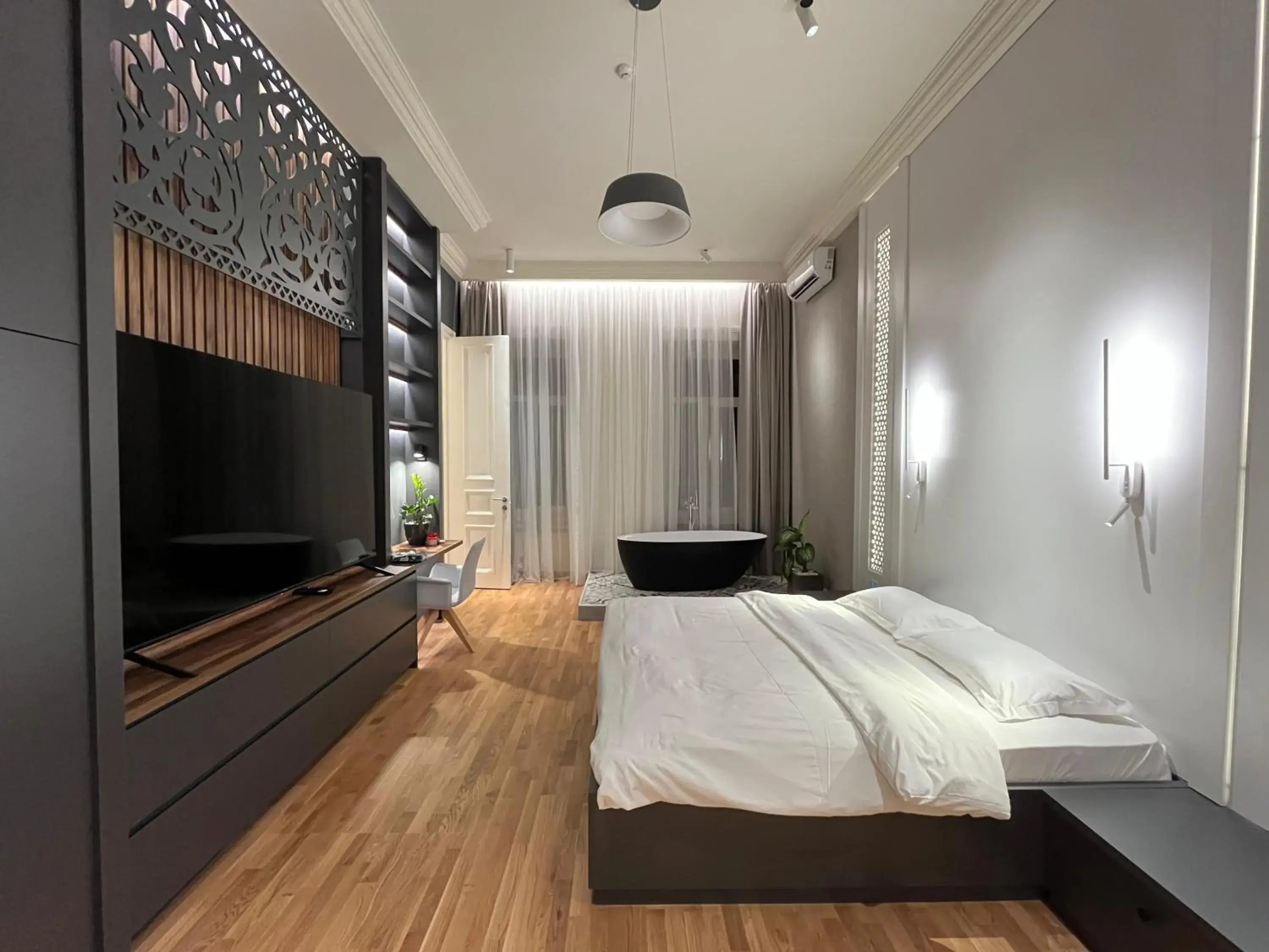 Communal lounge/ TV room, Bed in Paskunji Residence Communal lounge/ TV room, Bed in Paskunji Residence