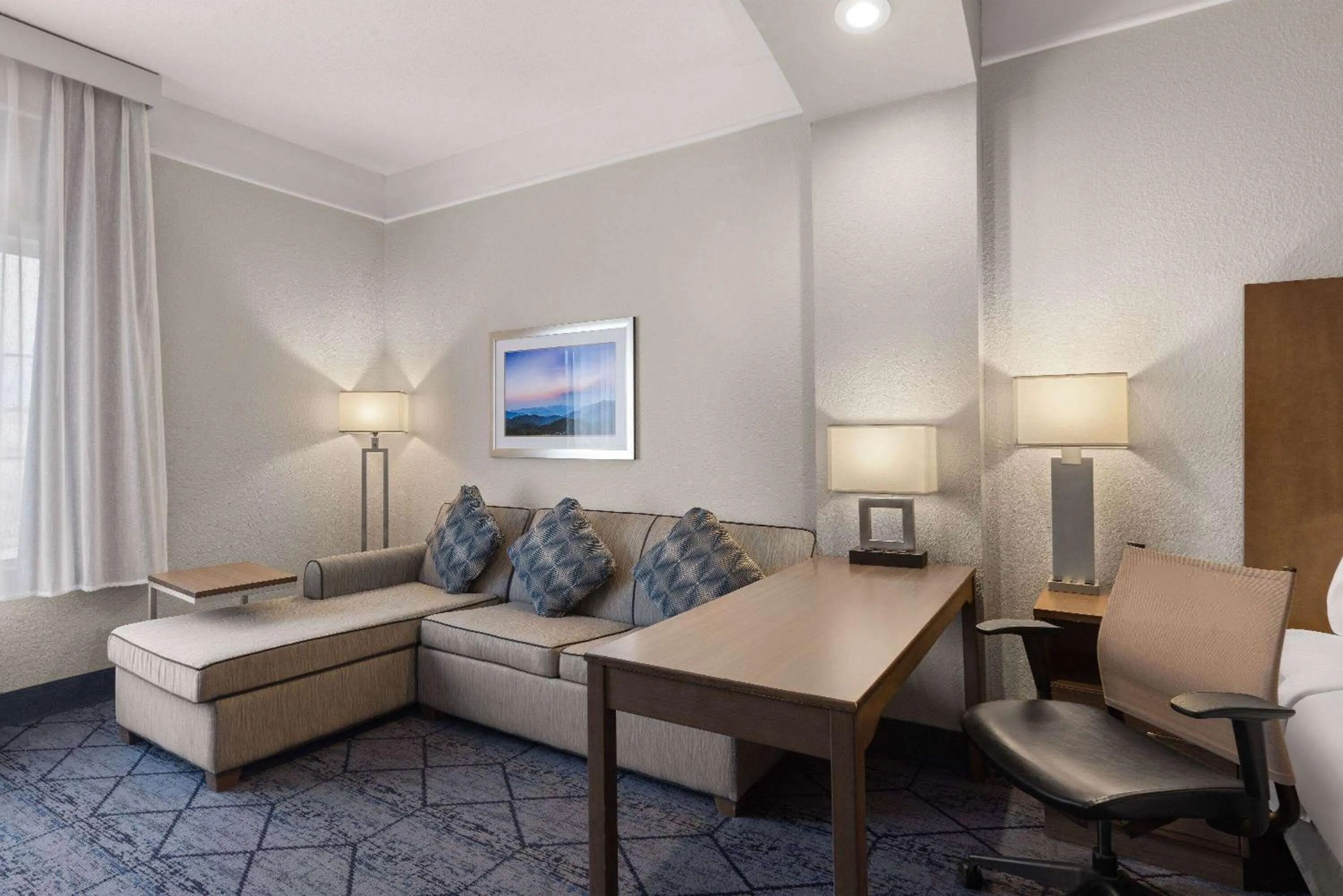 Bed in La Quinta Inn and Suites by Wyndham at WaTiki Waterpark