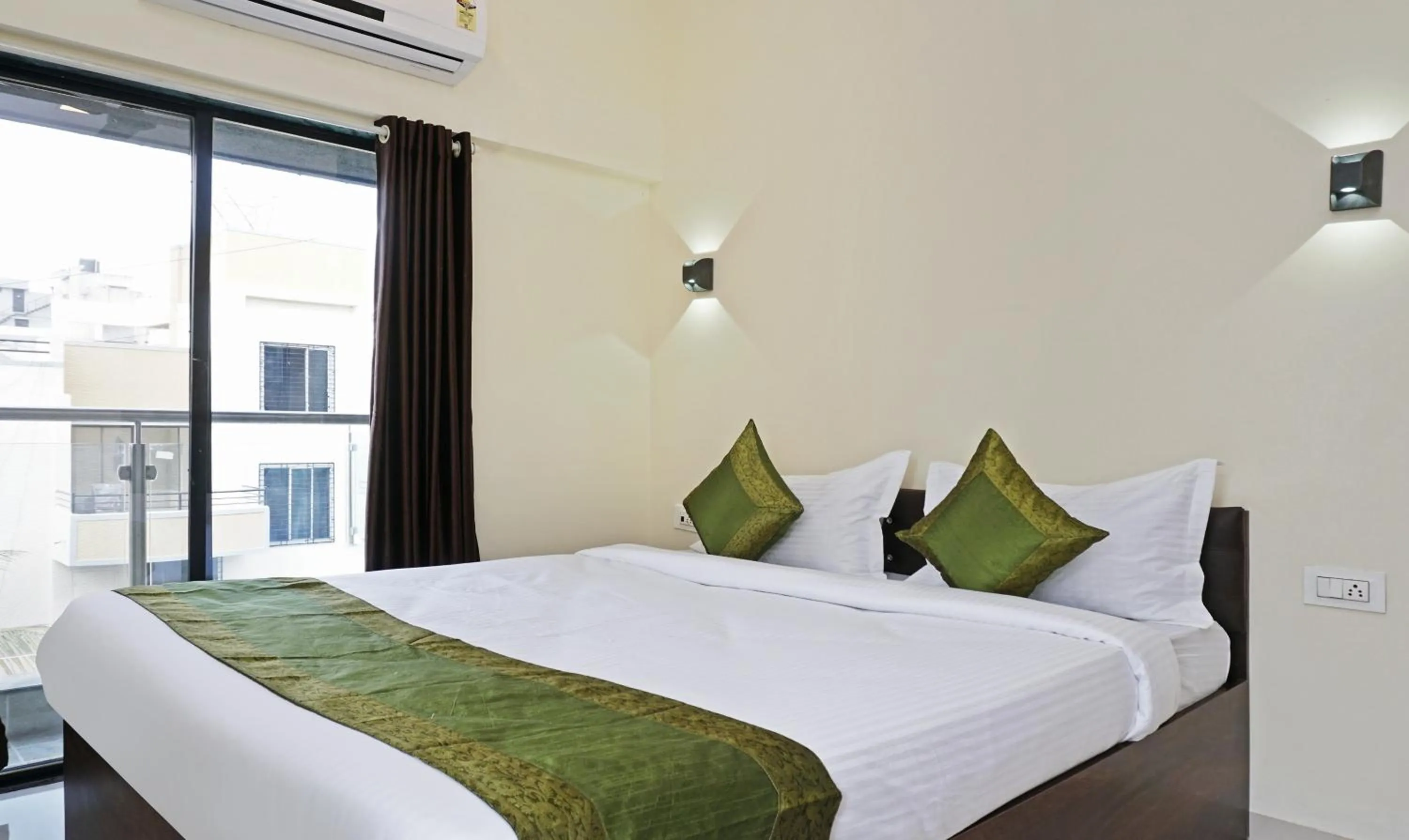 Bedroom, Bed in Treebo Lotus Baner