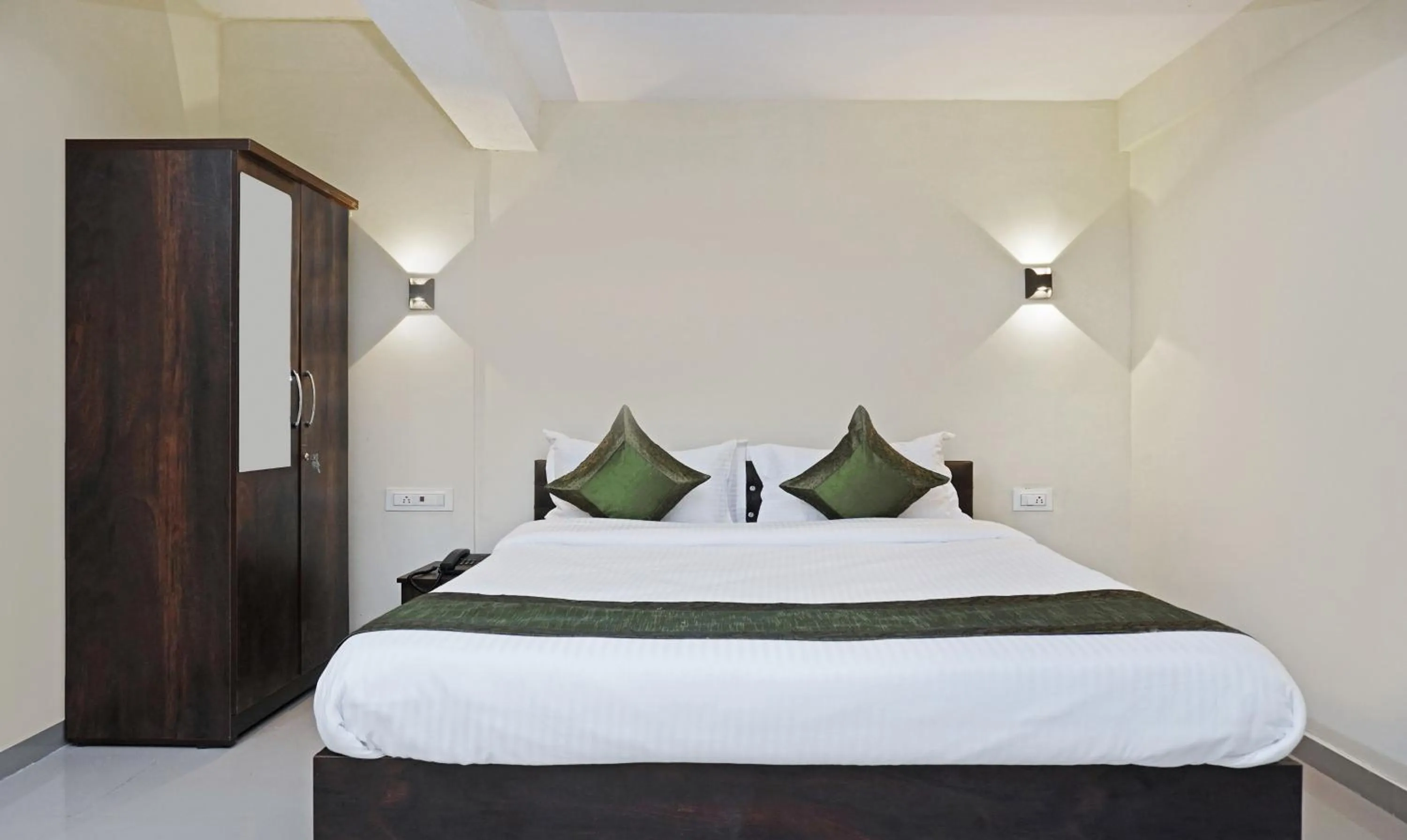 Bedroom, Bed in Treebo Lotus Baner