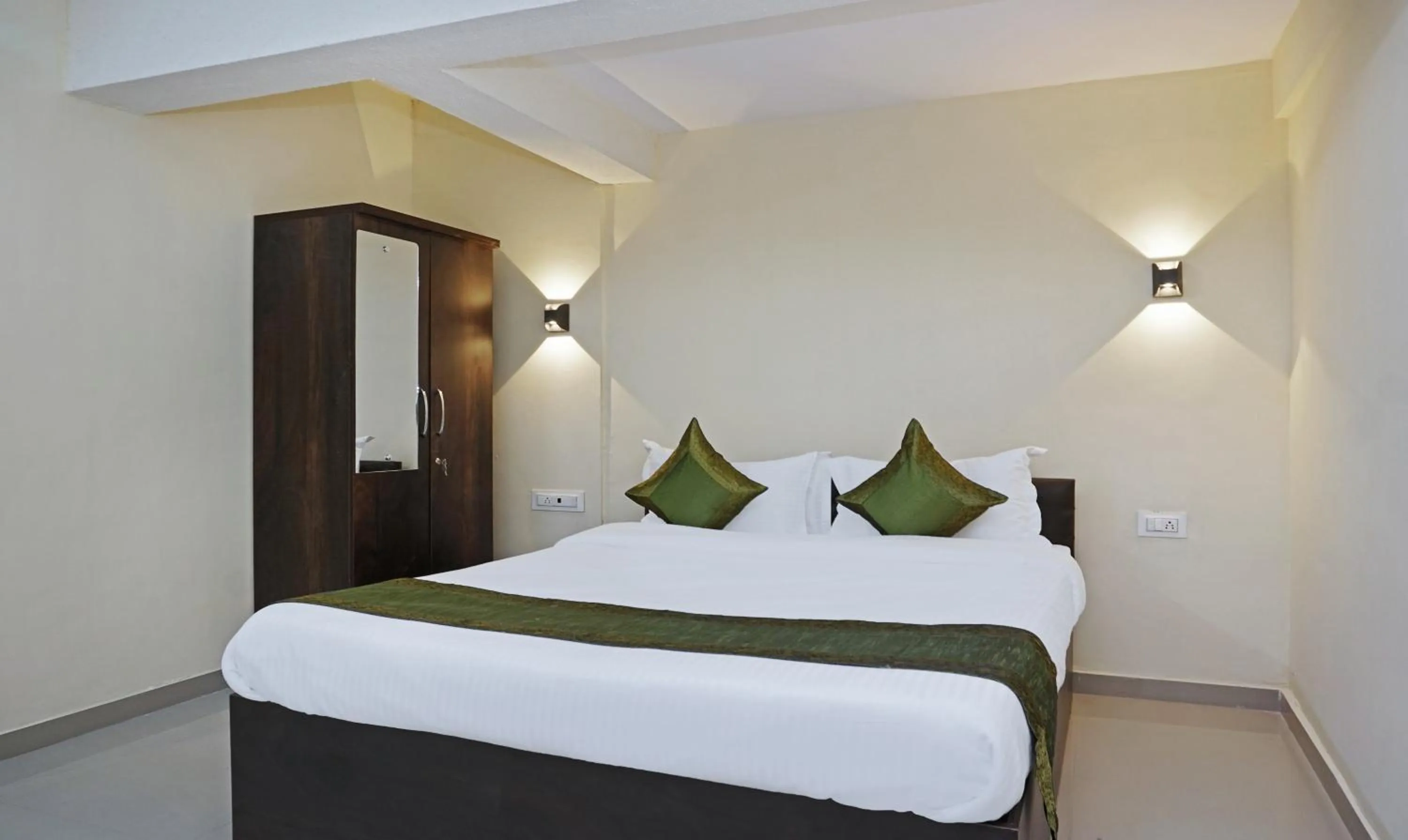 Bedroom, Bed in Treebo Lotus Baner