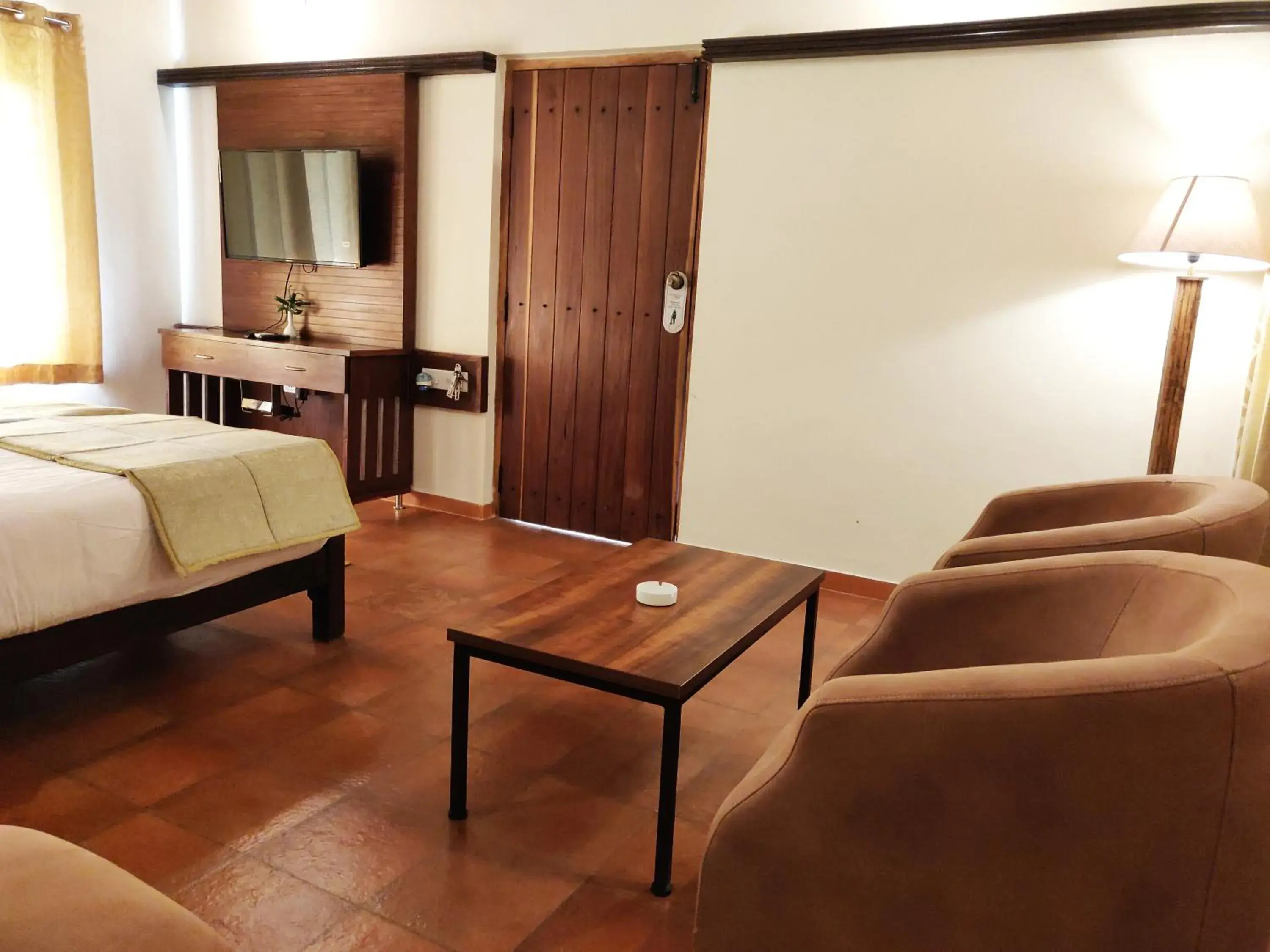 Seating area, Bed in Kadkani River Resort Coorg Seating area, Bed in Kadkani River Resort Coorg