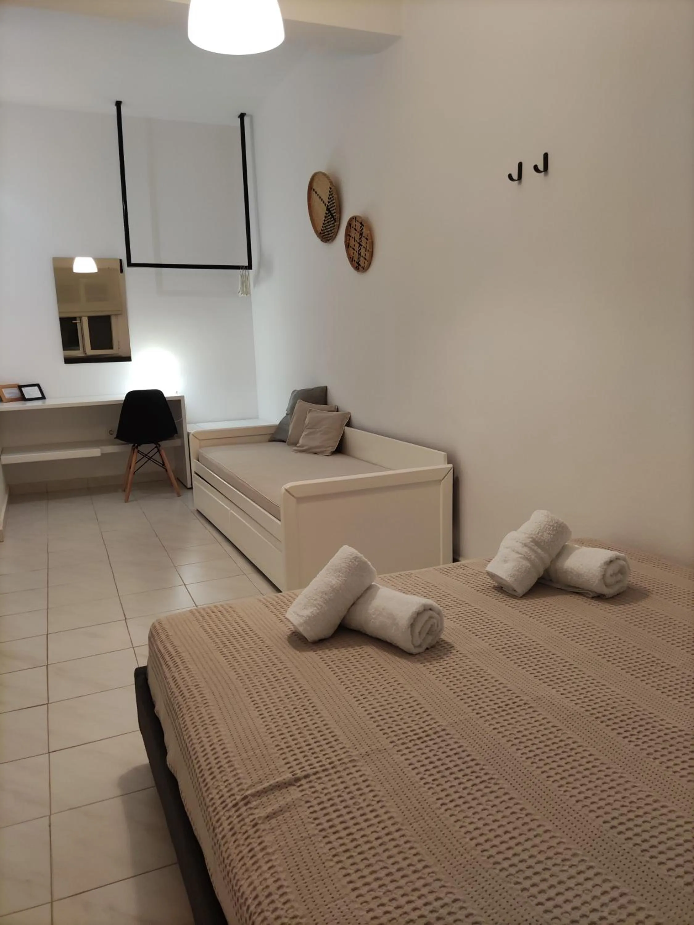 Bed in Galini Rooms & Apartments