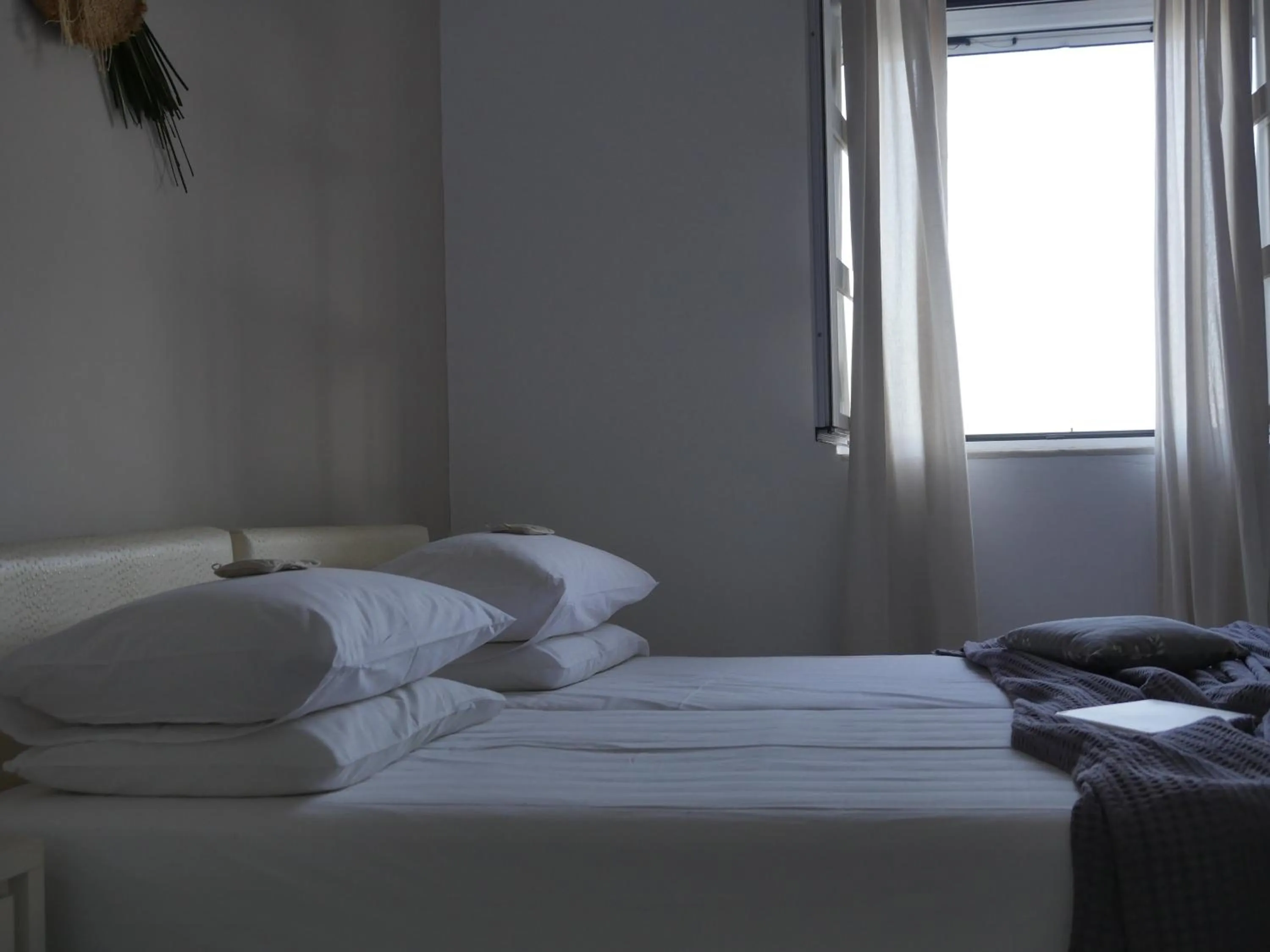 Bed in Galini Rooms & Apartments