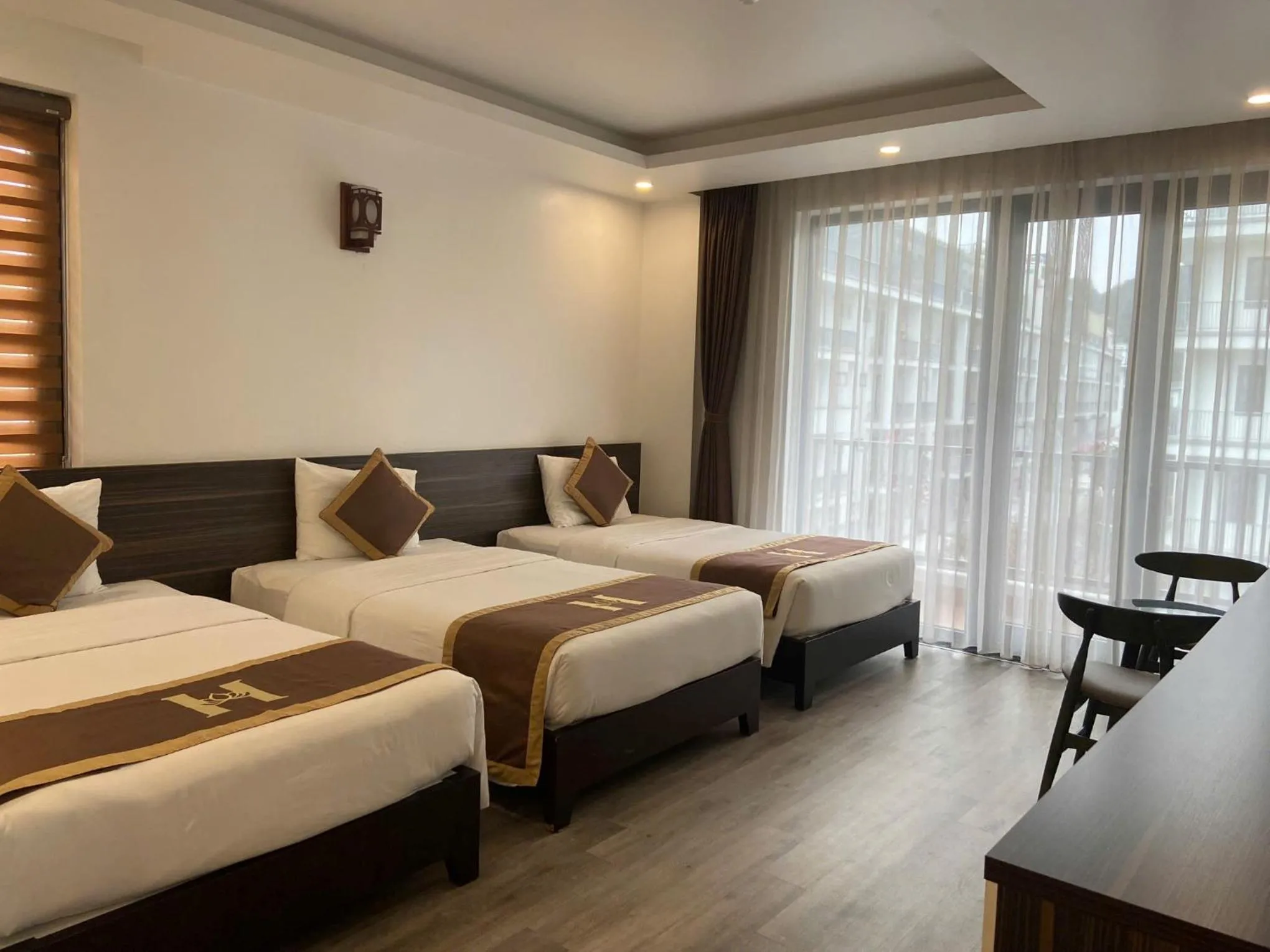 Seating area, Bed in Helen Halong Hotel