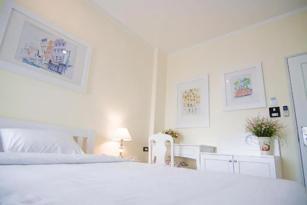 Bed in Boonsiri Boutique Hotel