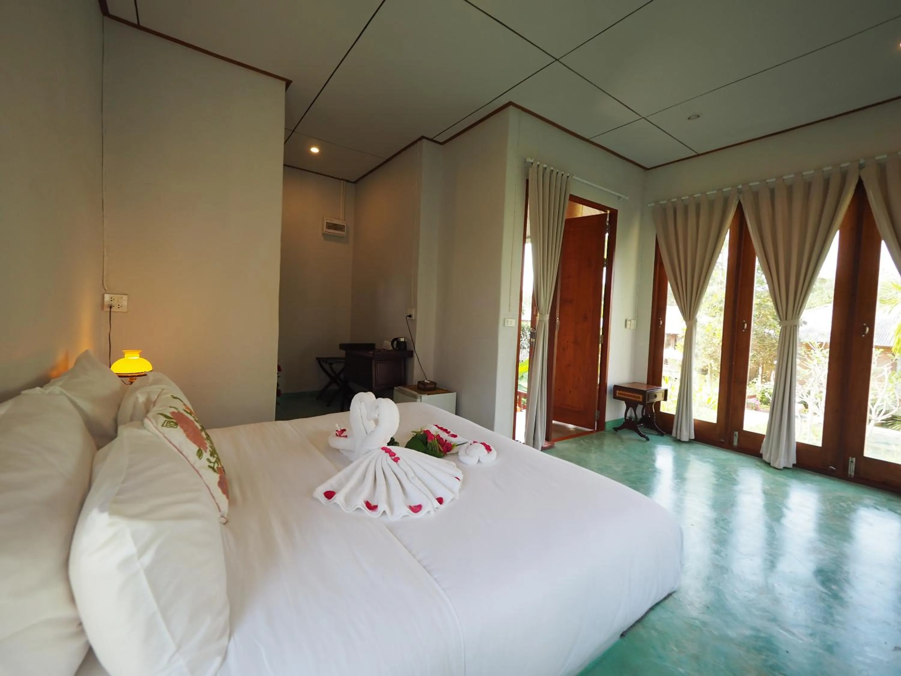 Bed in BaanSuk Sukhothai Resort