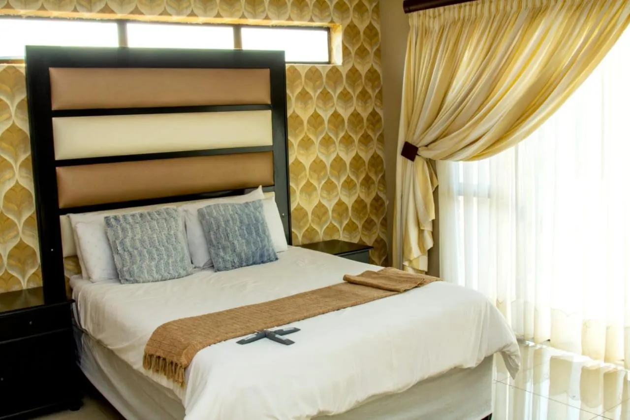 Bed in Vakhusi Guesthouse