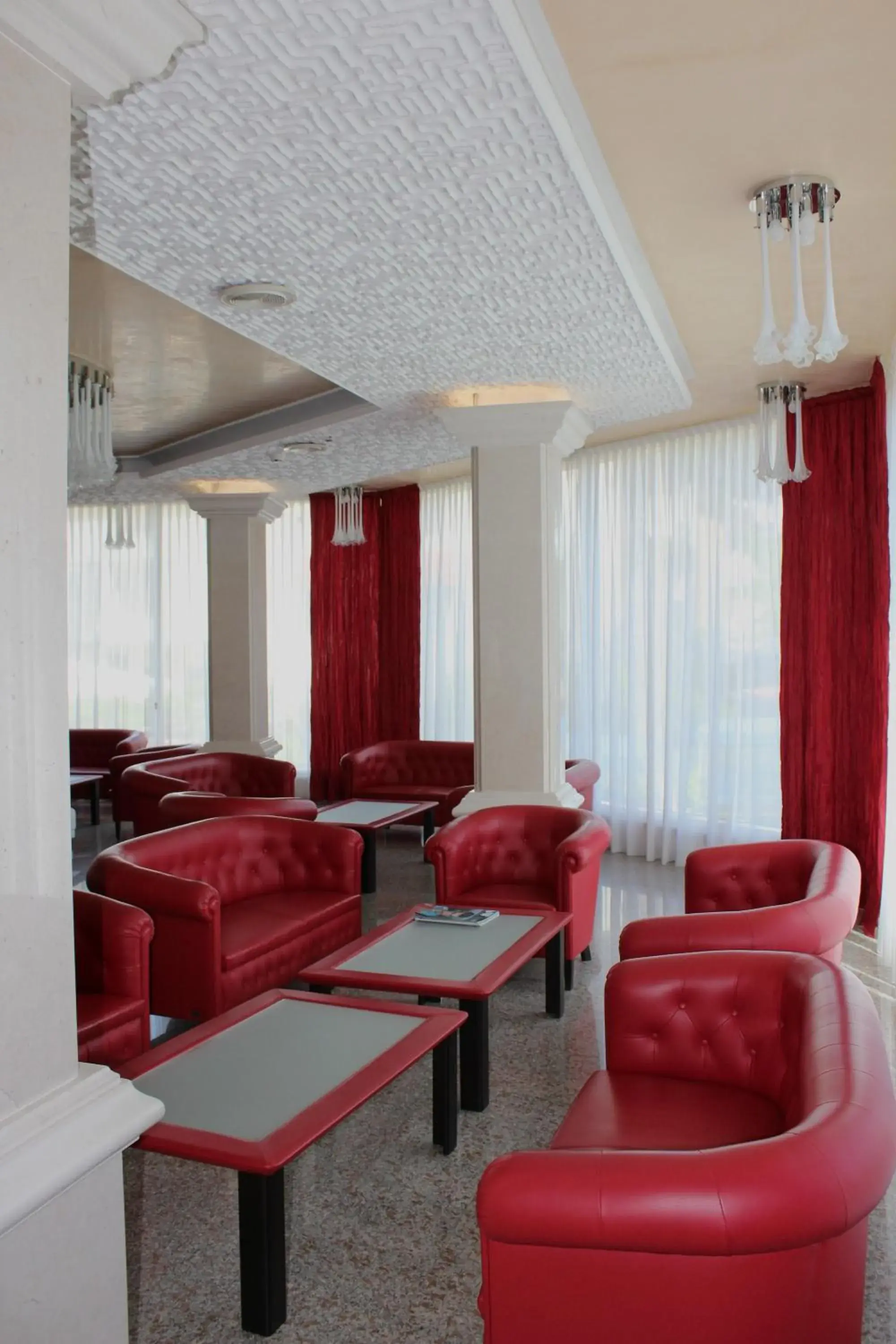 Communal lounge/ TV room, Seating Area in Hotel Buratti