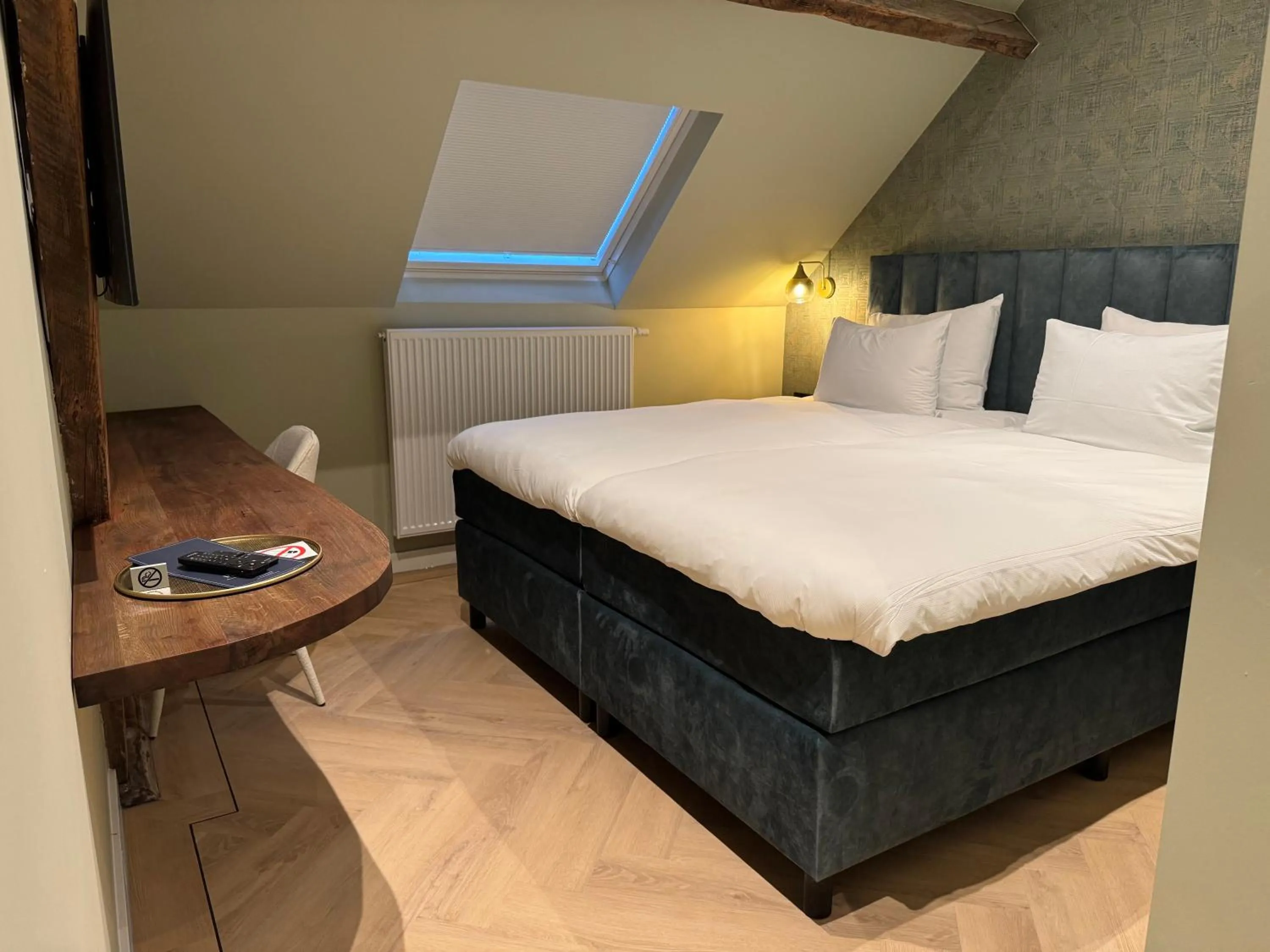 Bed in De Pastorie Bed & Breakfast