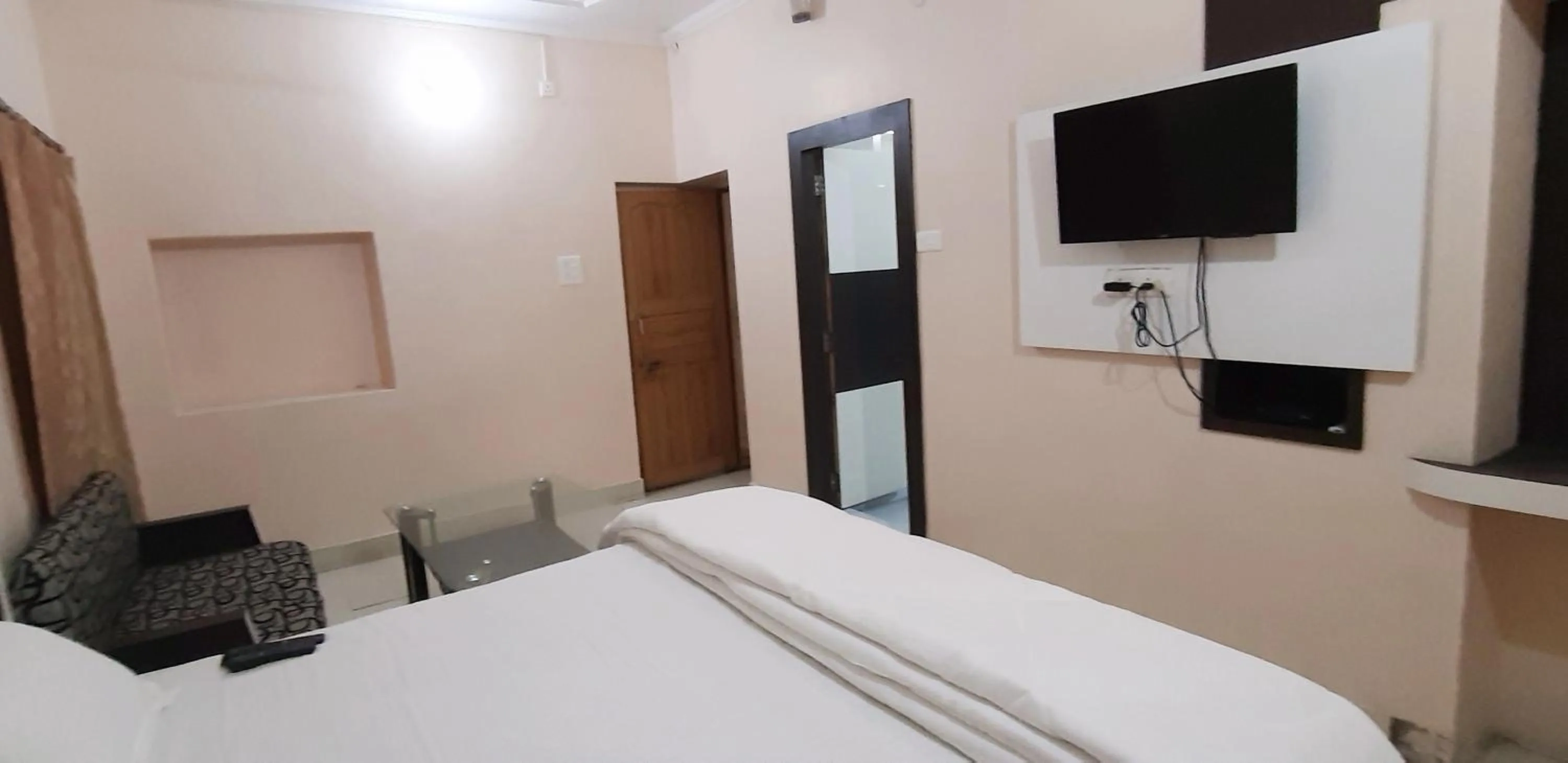 Photo of the whole room, Bed in Sita Inn Home Stay Away From Home By Hotel Sita Varanasi