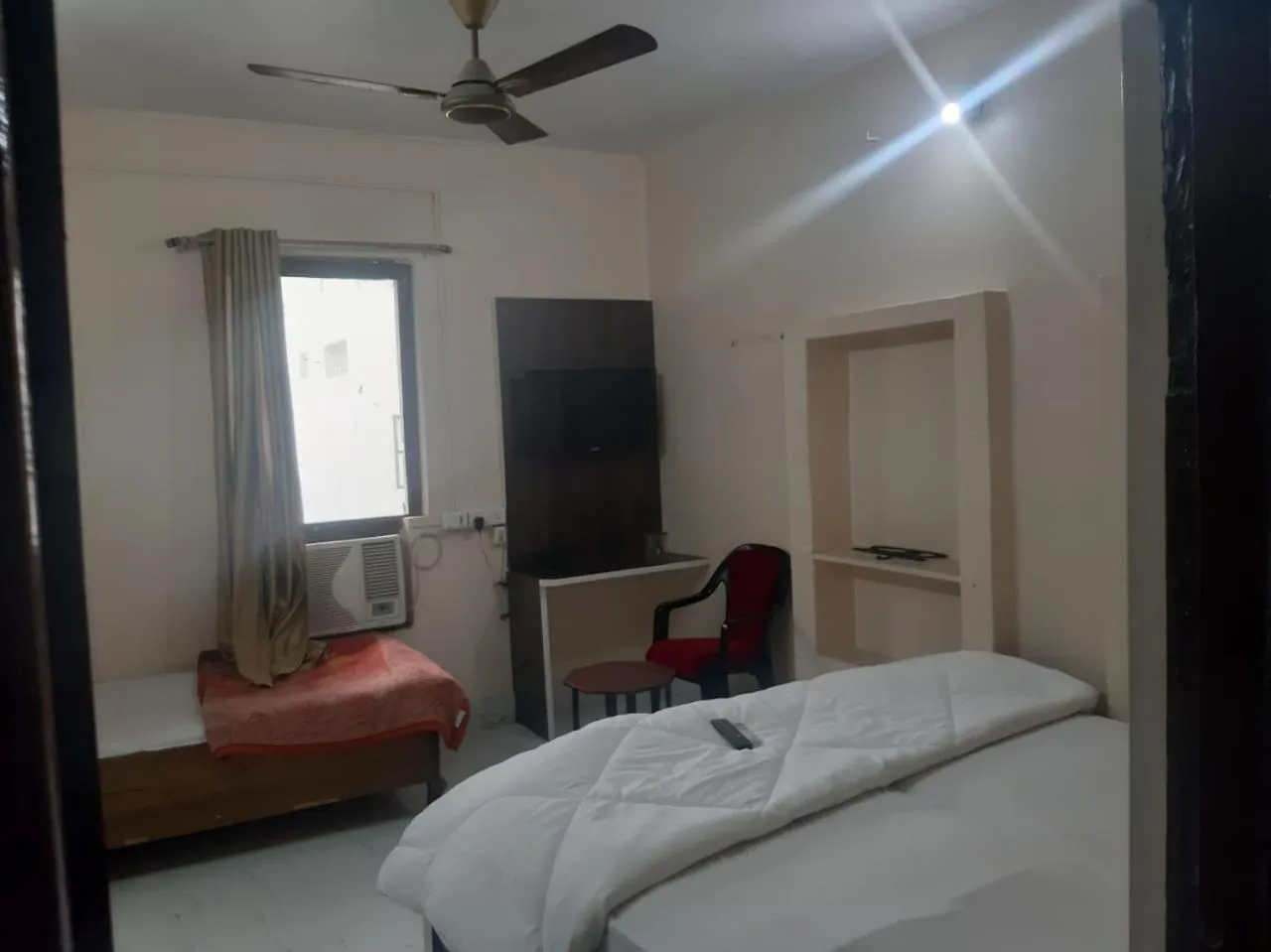Photo of the whole room, Bed in Sita Inn Home Stay Away From Home By Hotel Sita Varanasi