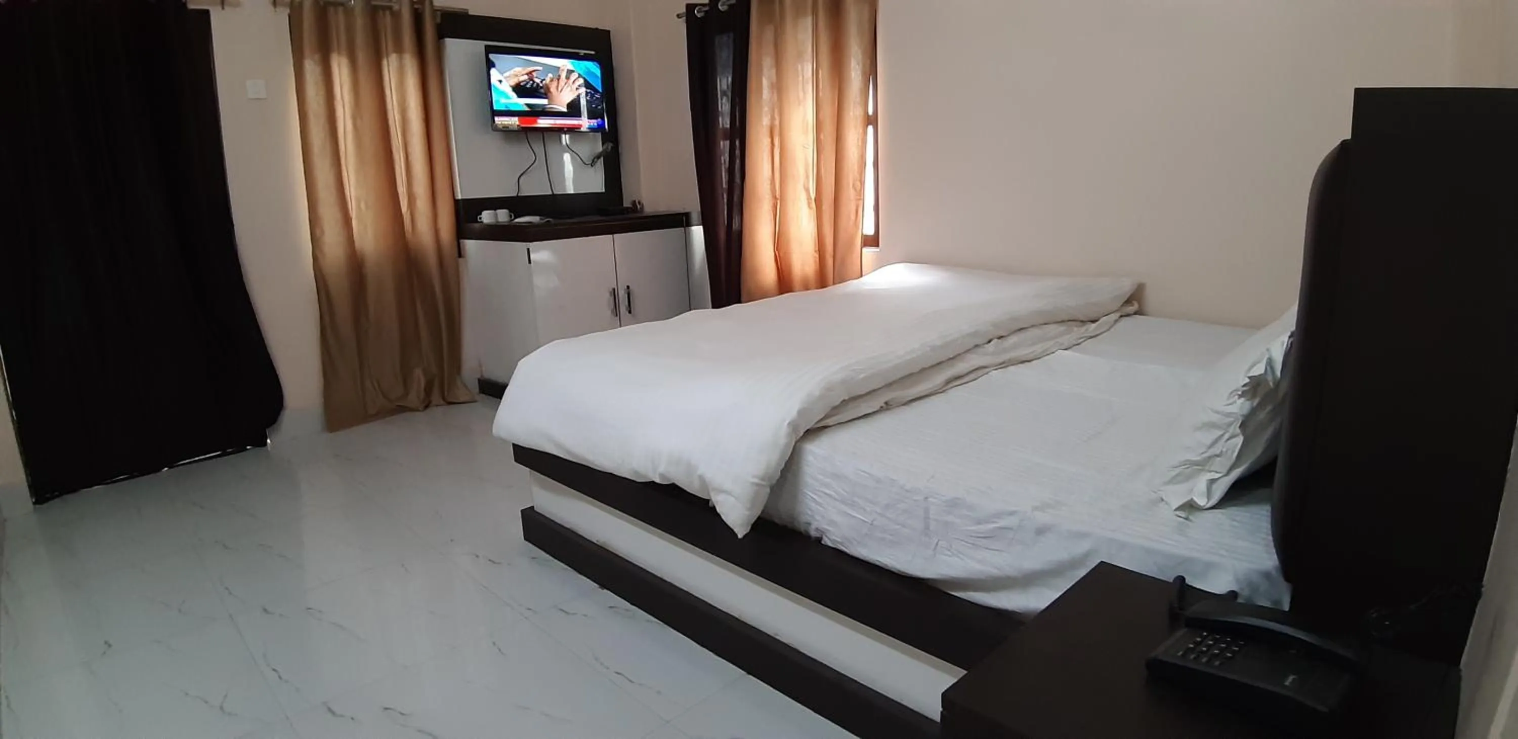 Photo of the whole room, Bed in Sita Inn Home Stay Away From Home By Hotel Sita Varanasi