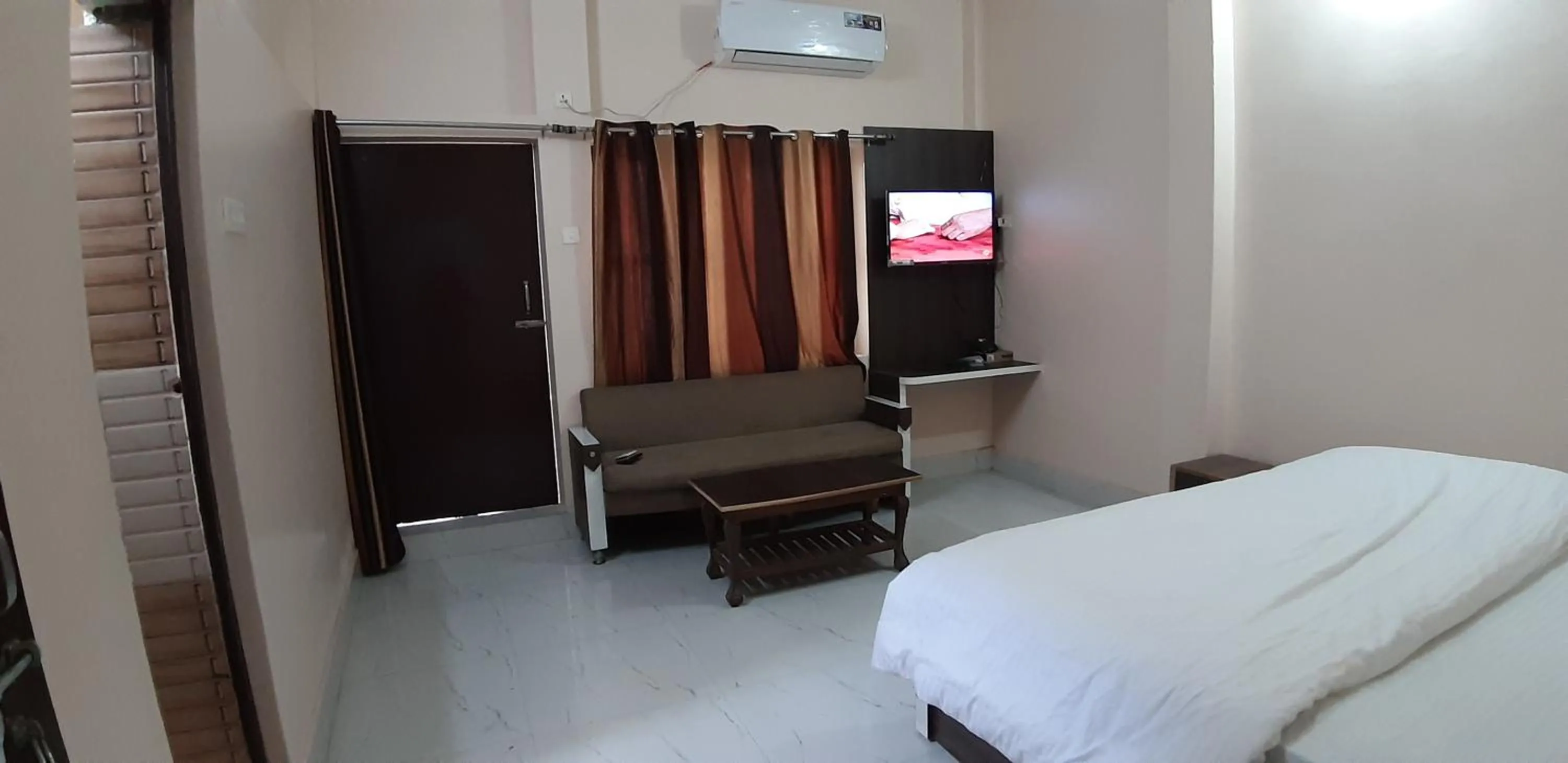 Photo of the whole room, Bed in Sita Inn Home Stay Away From Home By Hotel Sita Varanasi