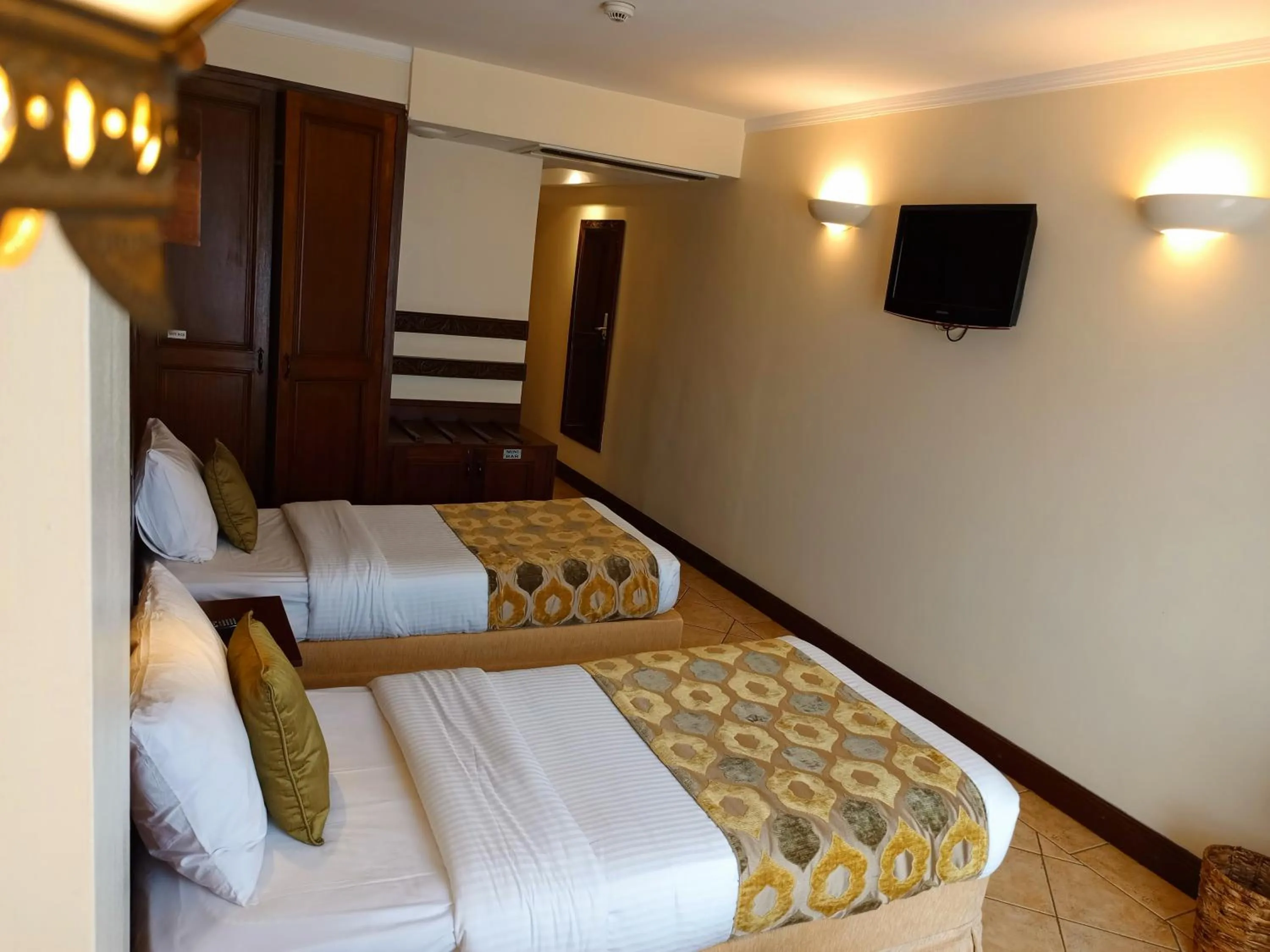 Bed in The Heron By Sarovar Portico India