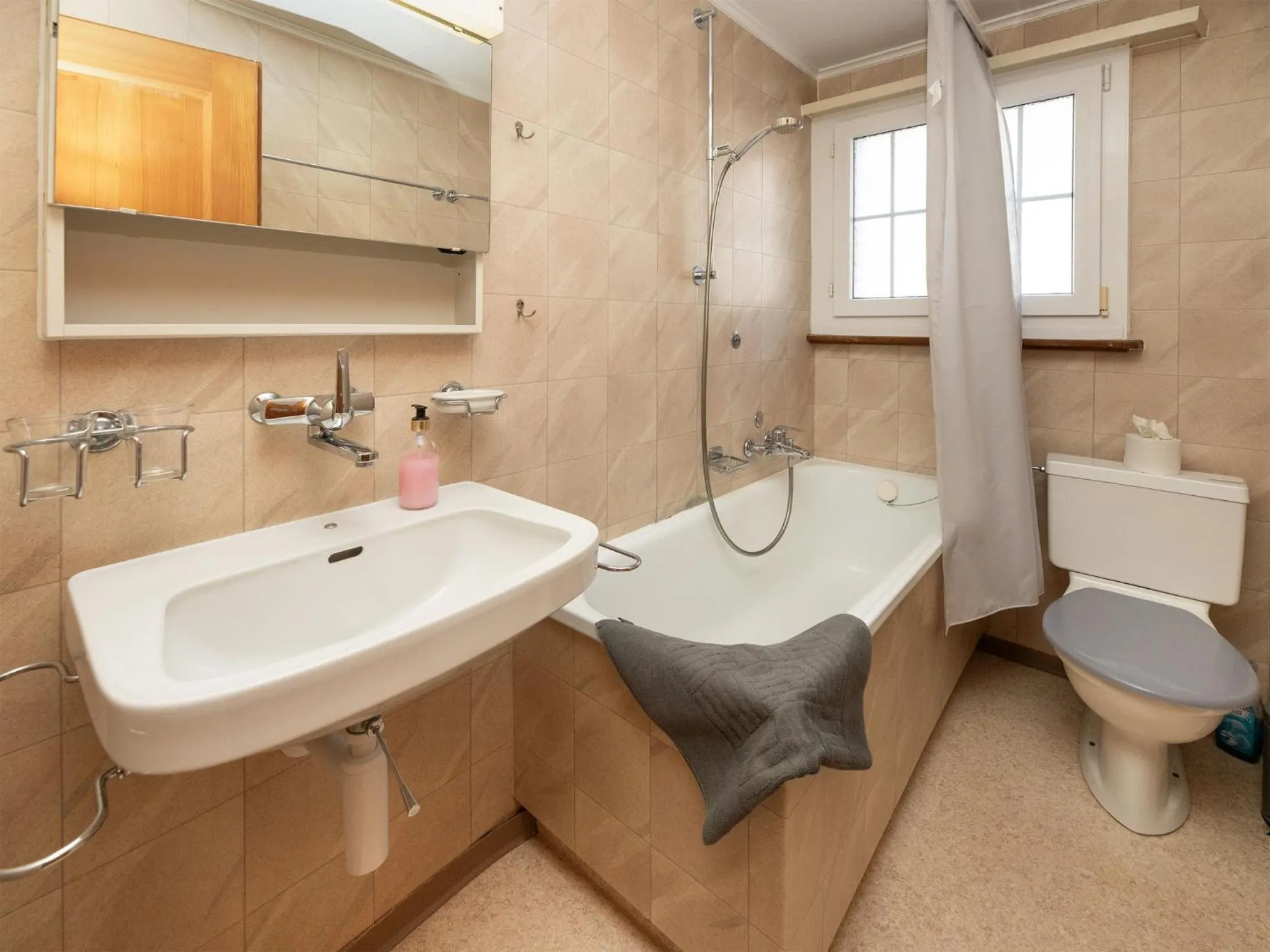 Bathroom in Apartment Chalet Spassvogel by Interhome
