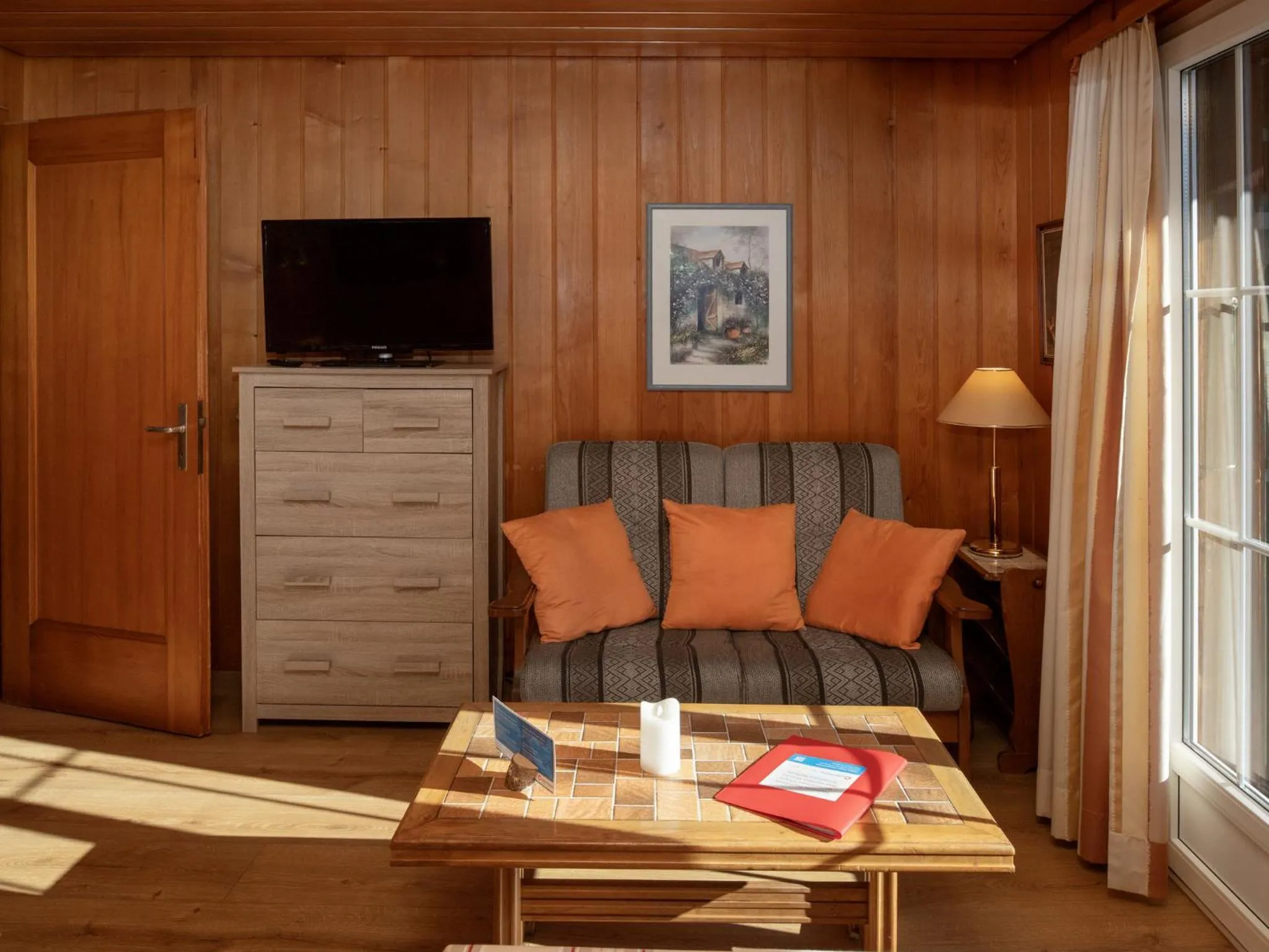 Living room in Apartment Chalet Spassvogel by Interhome