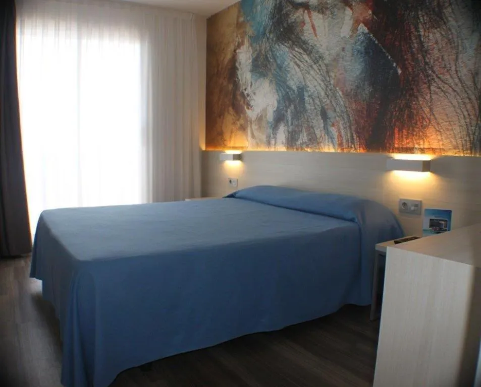 Bed in Hotel Riviera