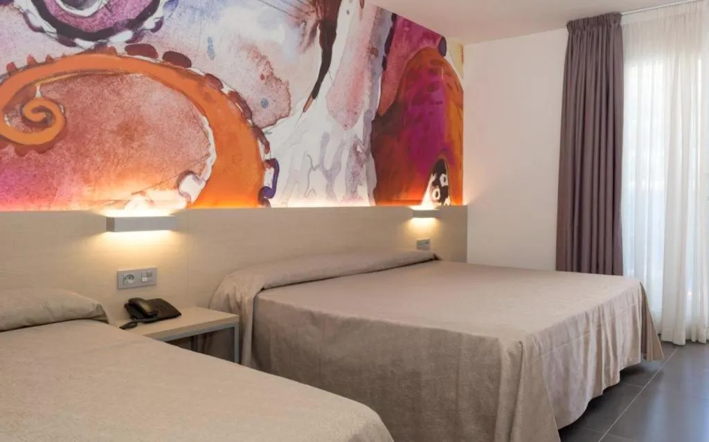 Bed in Hotel Riviera