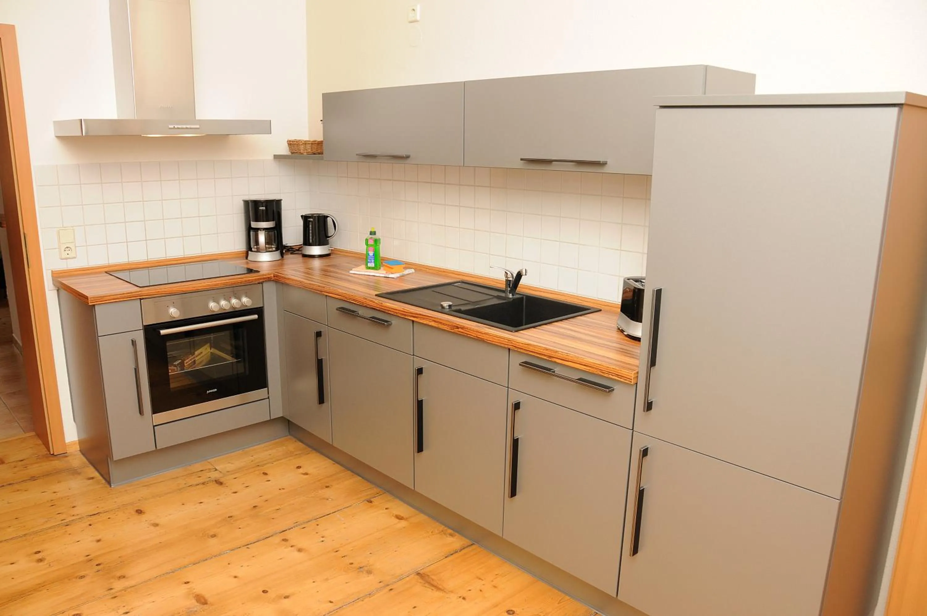 Kitchen or kitchenette in Apartments am Brunnen