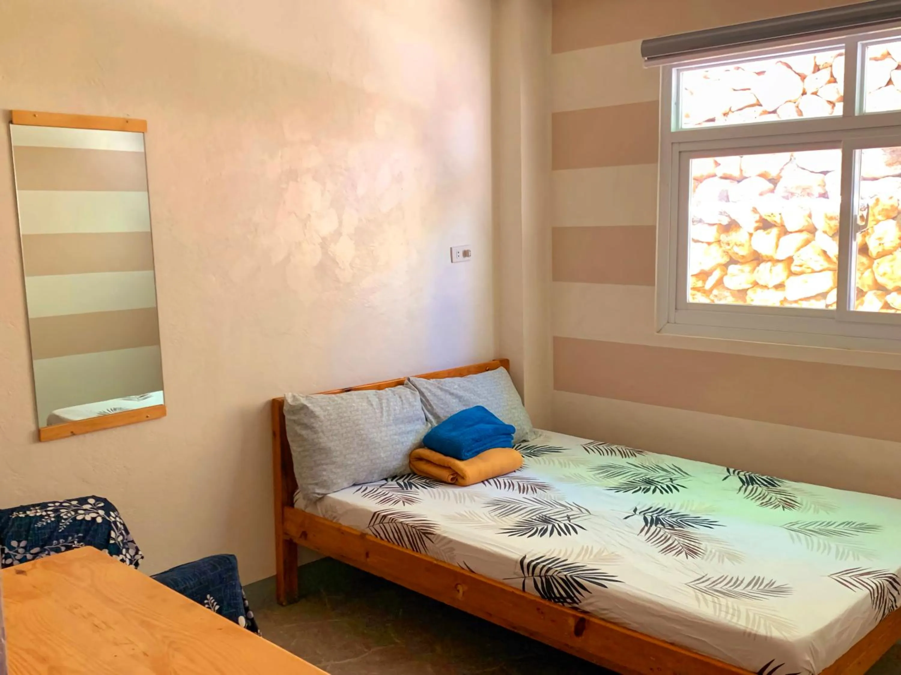 Bed in Wanay's Rocky Mountain Homestay